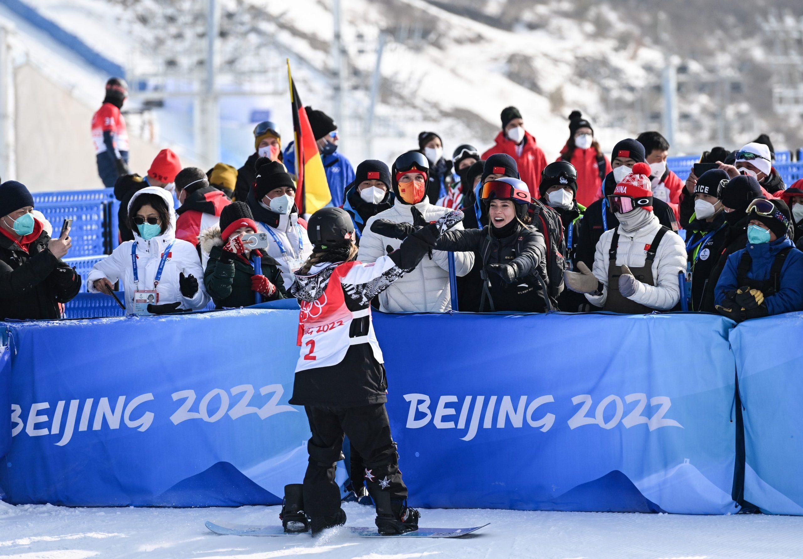 Chloe Kim hugs Eileen Gu after winning gold on the halfpipe at the 2022 Beijing Olympics.