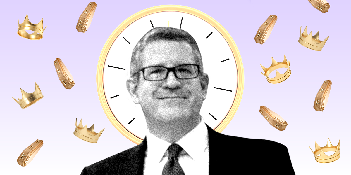 A picture of Andrew Parker in front of a clock with crowns and coffins in the background
