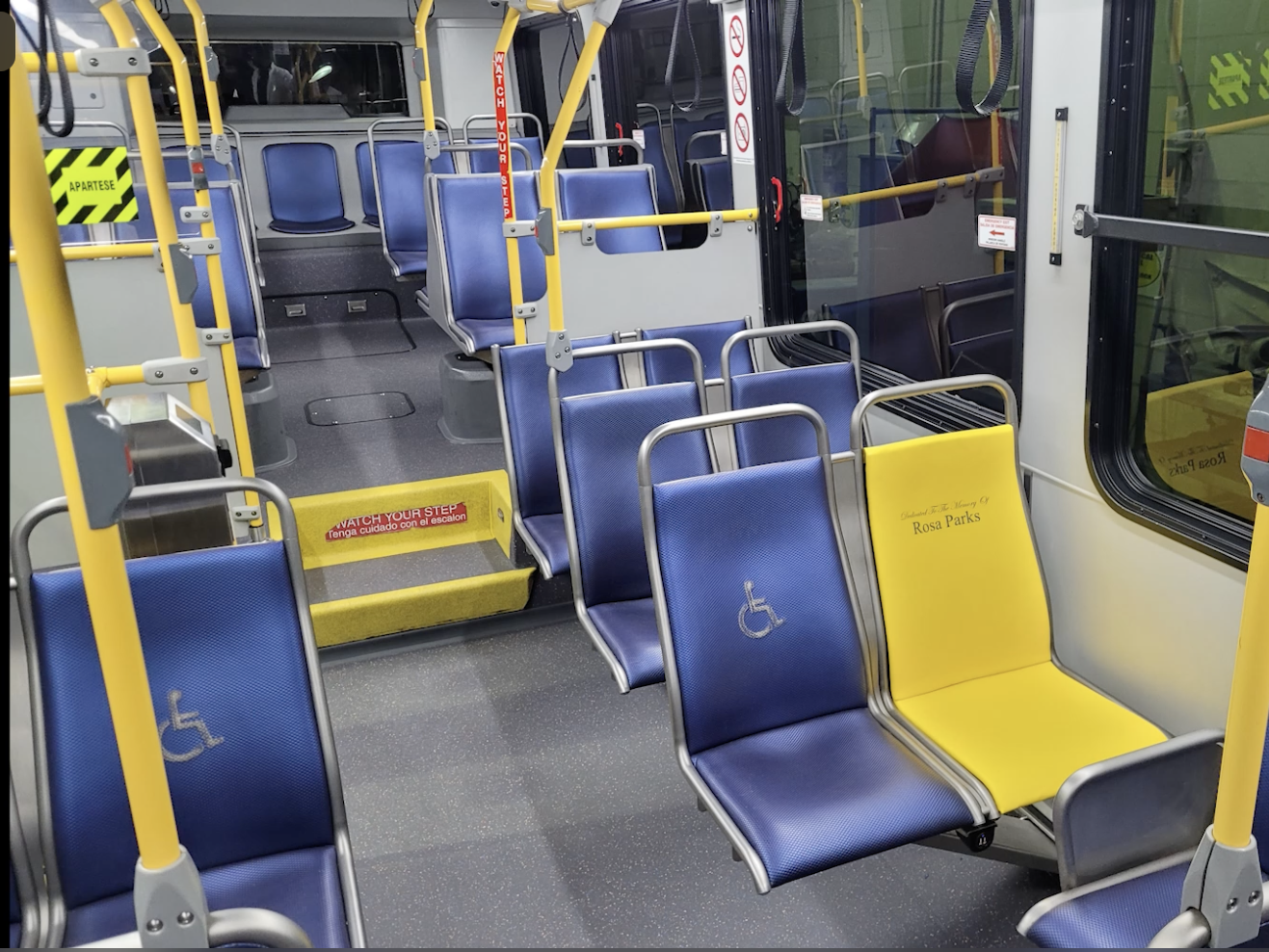 A photo of a bus in Houston with one yellow seat, intended to honor Rosa Parks.