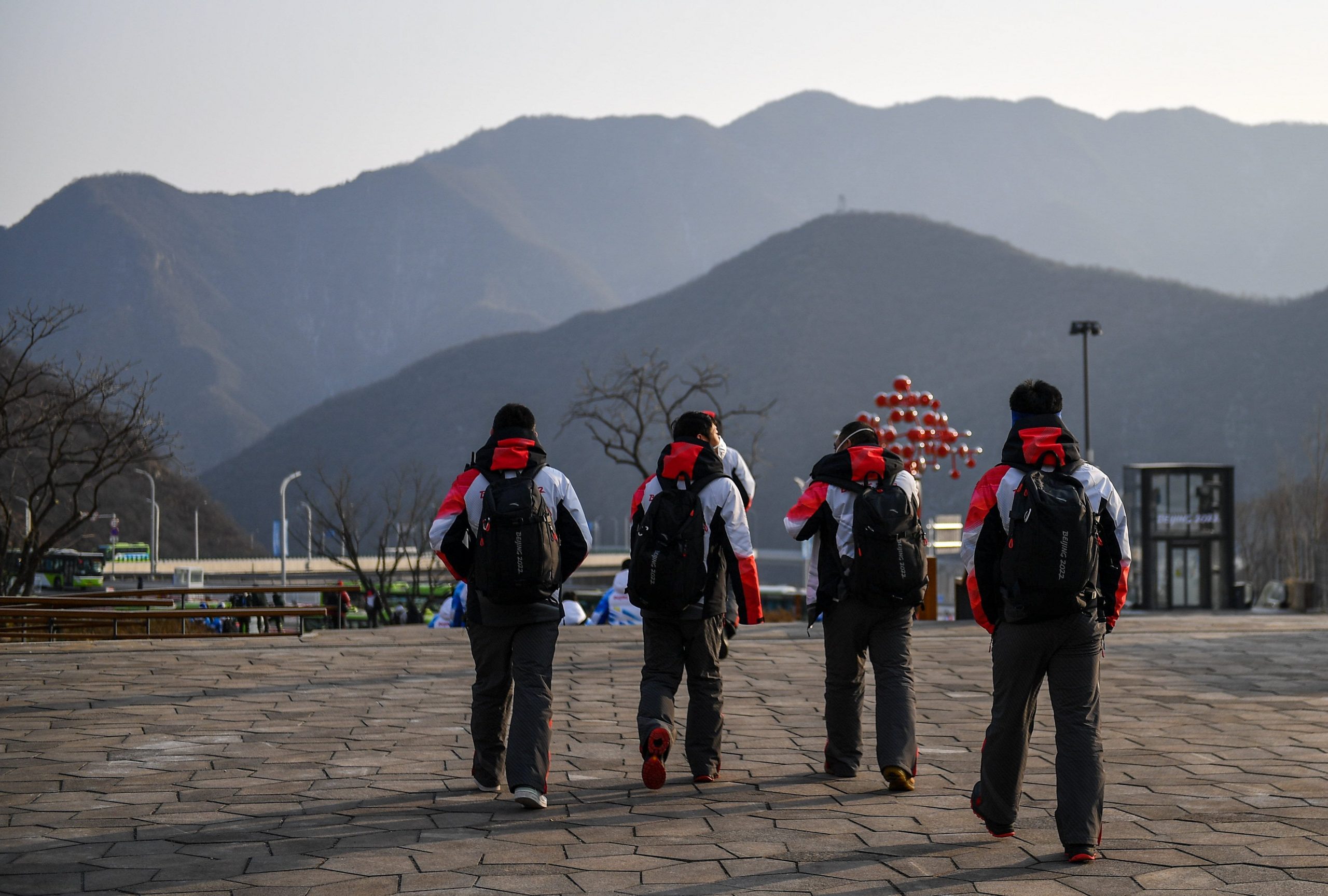 Beijing 2022 volunteers make their way home after day six of the Beijing 2022 Winter Olympic Games at National Alpine Skiing Centre in Yanqing, China.