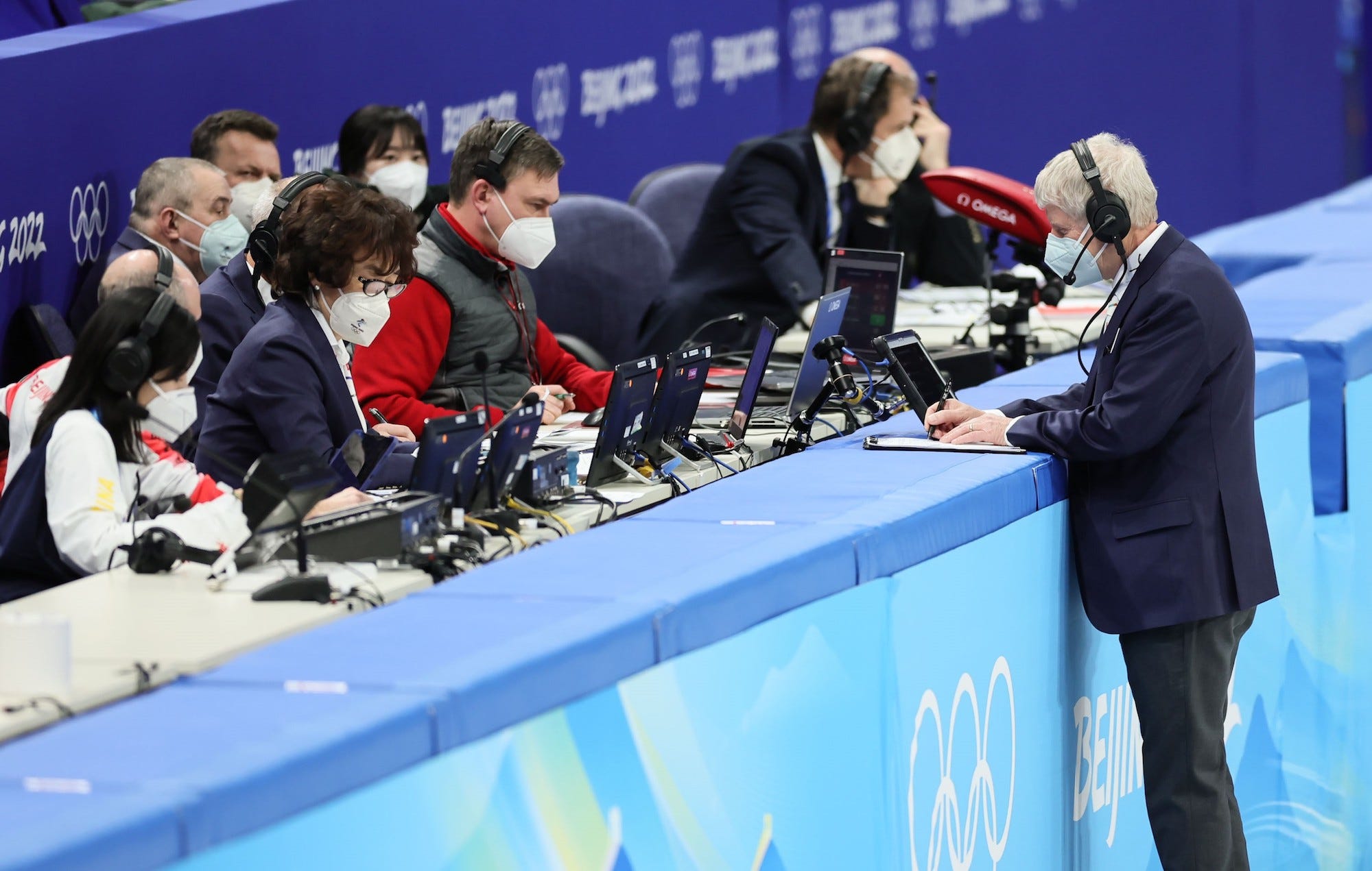 Judges work after the mixed team relay final of short track speed skating at Capital Indoor Stadium in Beijing