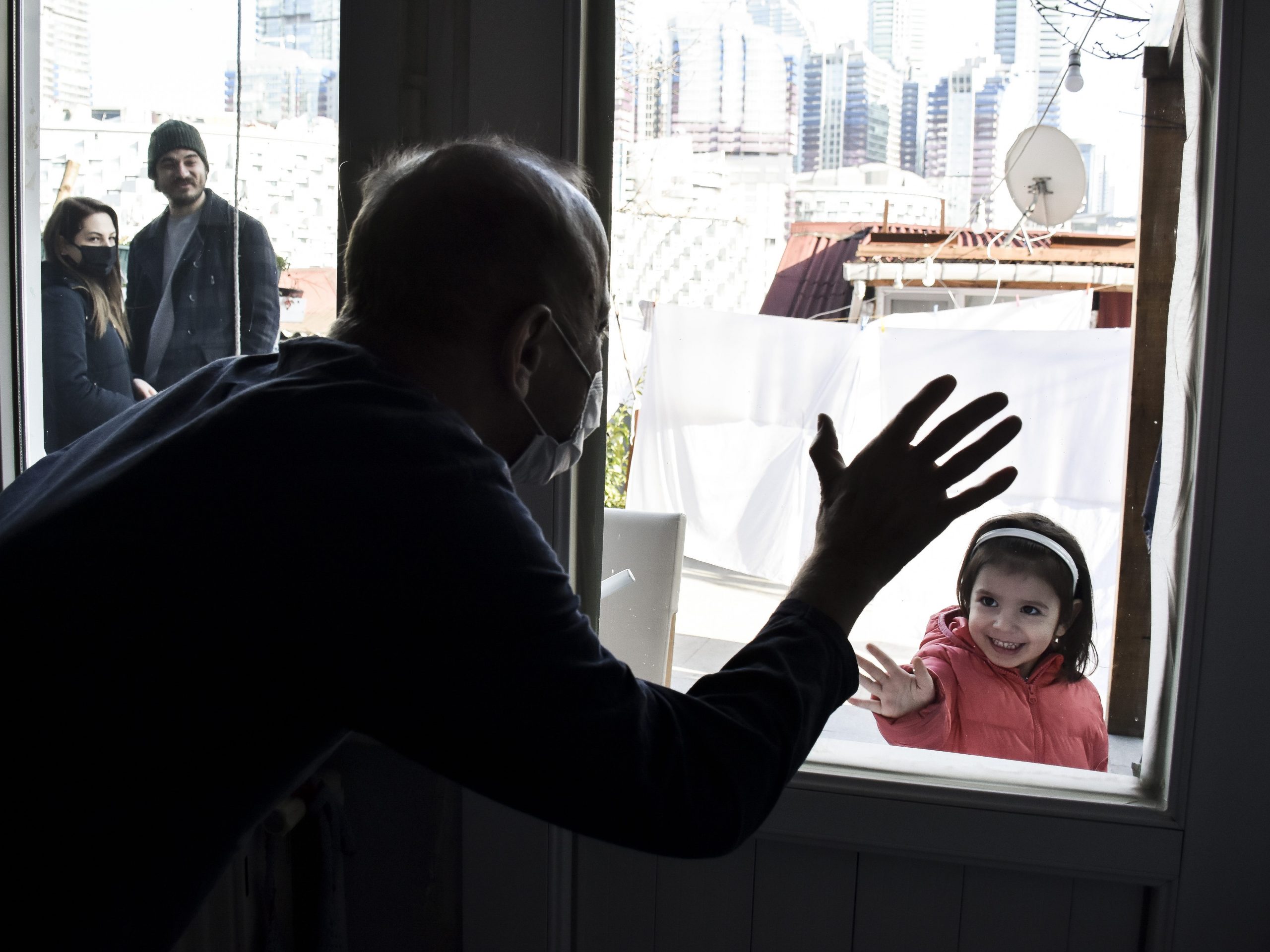 Muzaffer Kayasan talks to his granddaughter in Istanbul, Turkiye on February 05, 2022.