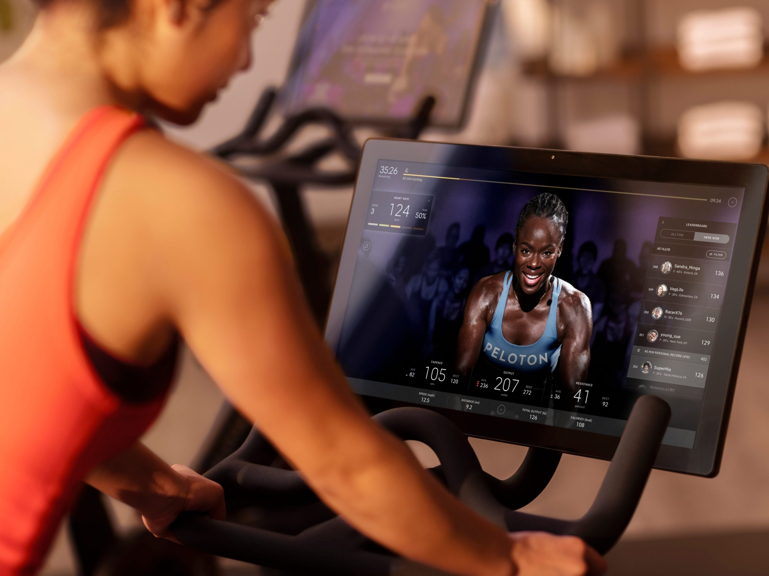 A user watching an instructor on a Peloton bike.