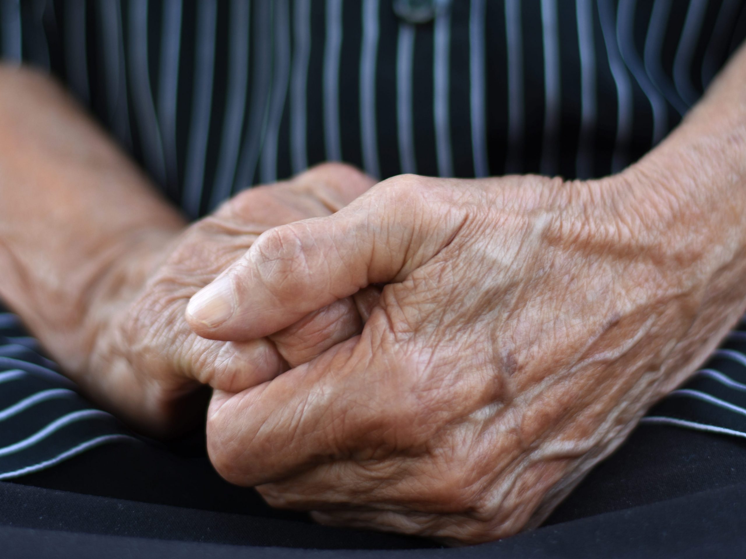 Stock image of the hands of an elderly woman.