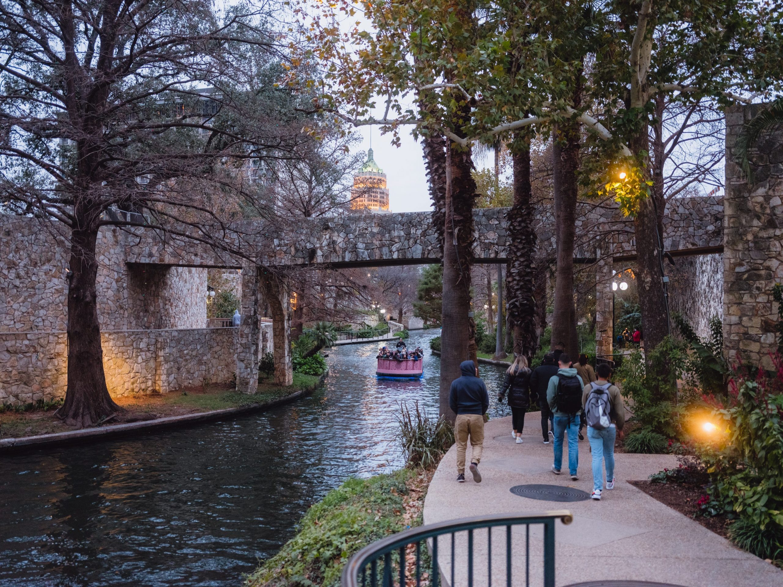 People walking along the river in San Antonio, Texas