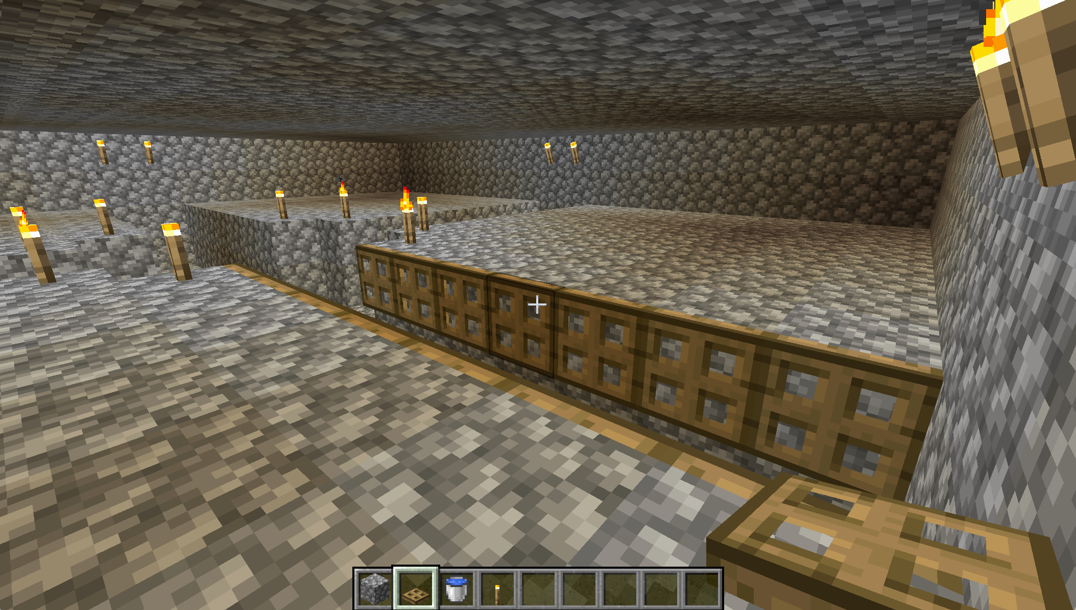 A screenshot from Minecraft, showing a gap lined by opened trapdoors.