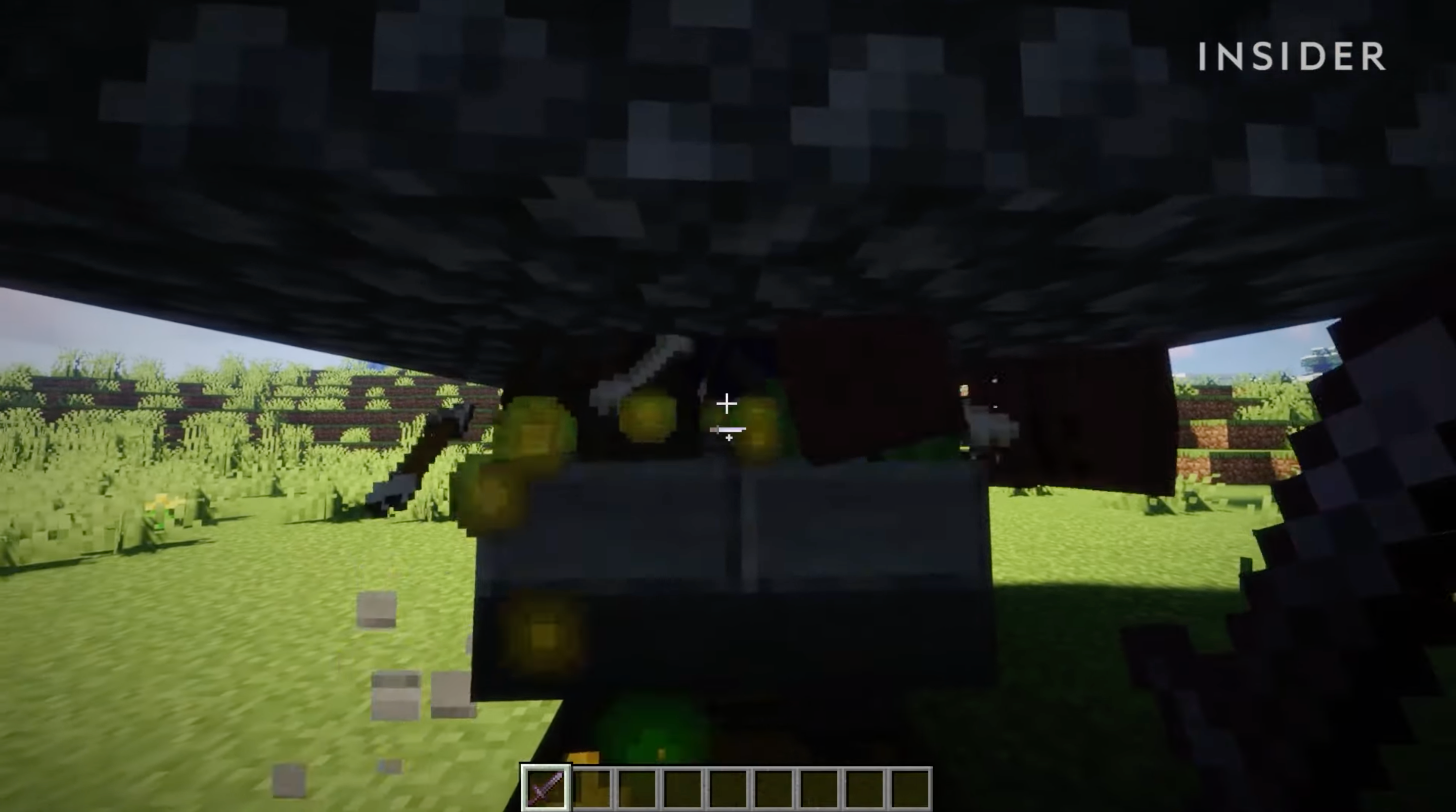 A screenshot from Minecraft, showing mobs stuck at the bottom of a well.