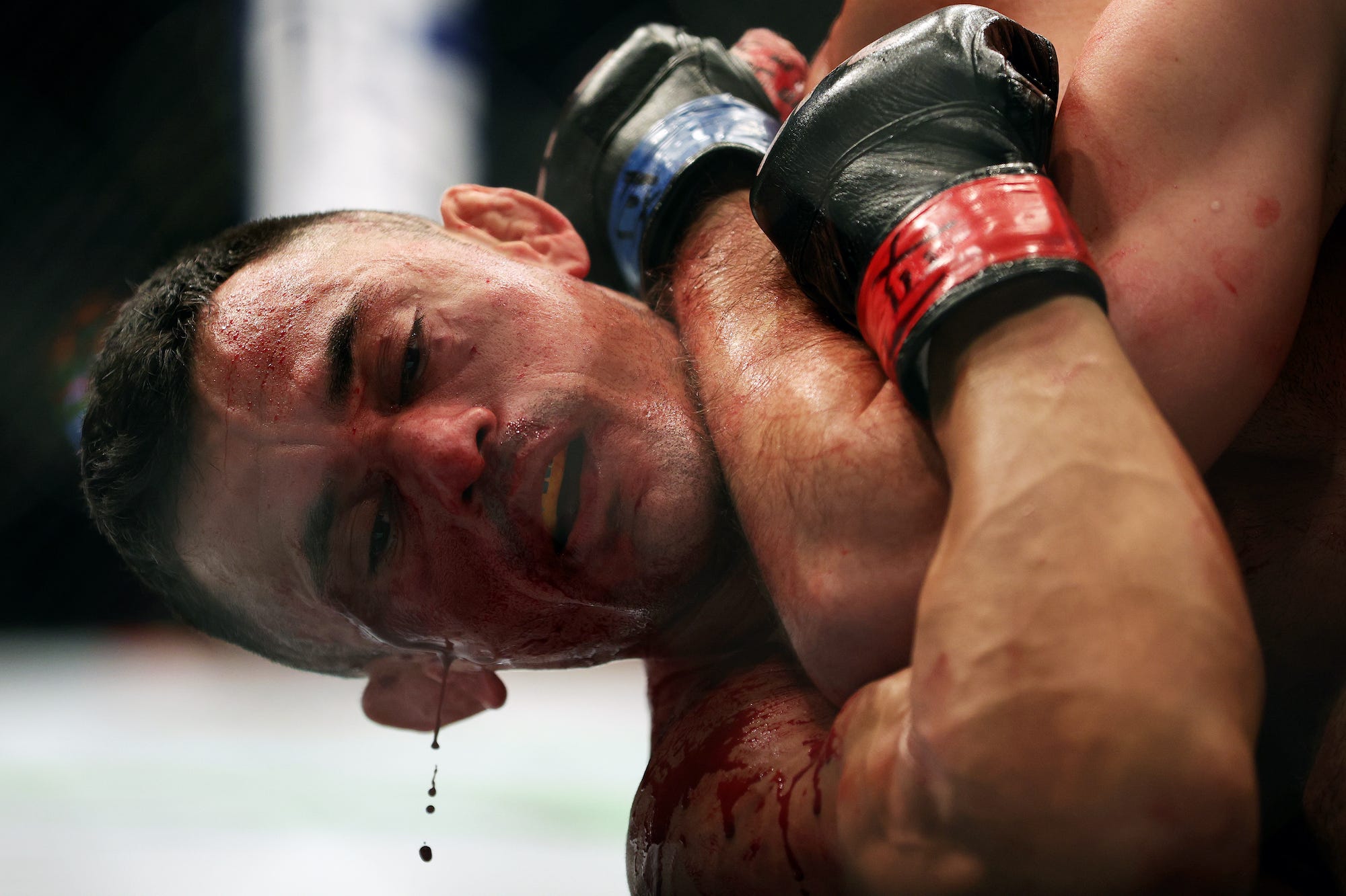 Dripping in blood, Douglas Silva wins in style.