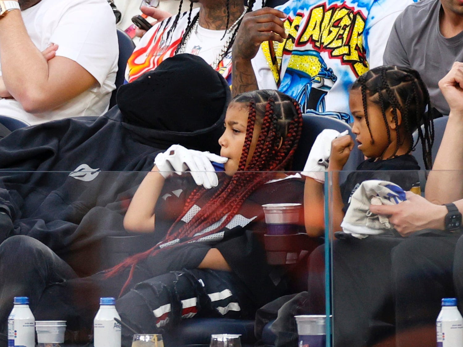 Kanye West and his kids catch Odell Beckham Jr's gloves ahead of Super Bowl LVI.