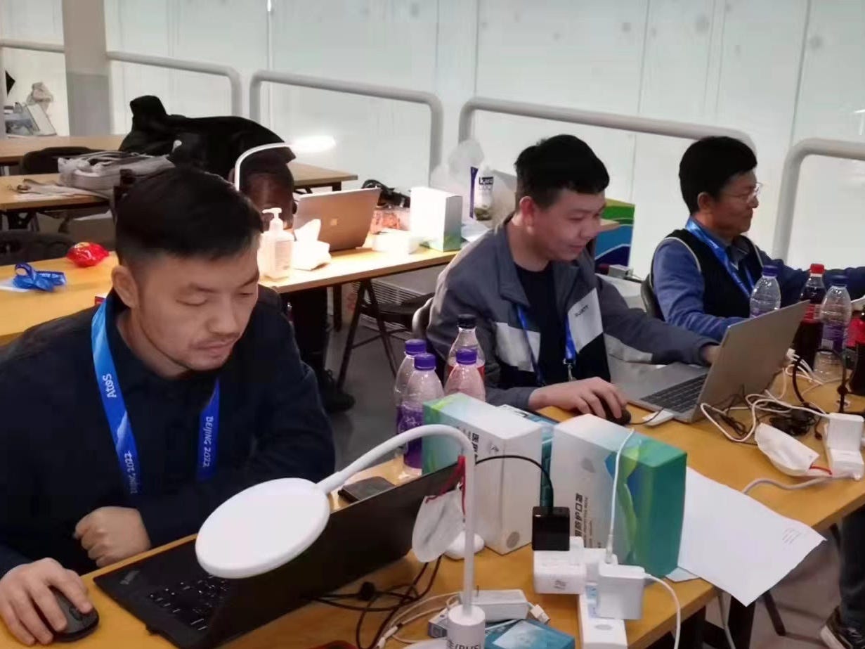 Staff at the Beijing National Aquatics Center combing through data received from the thermometers on their computers.