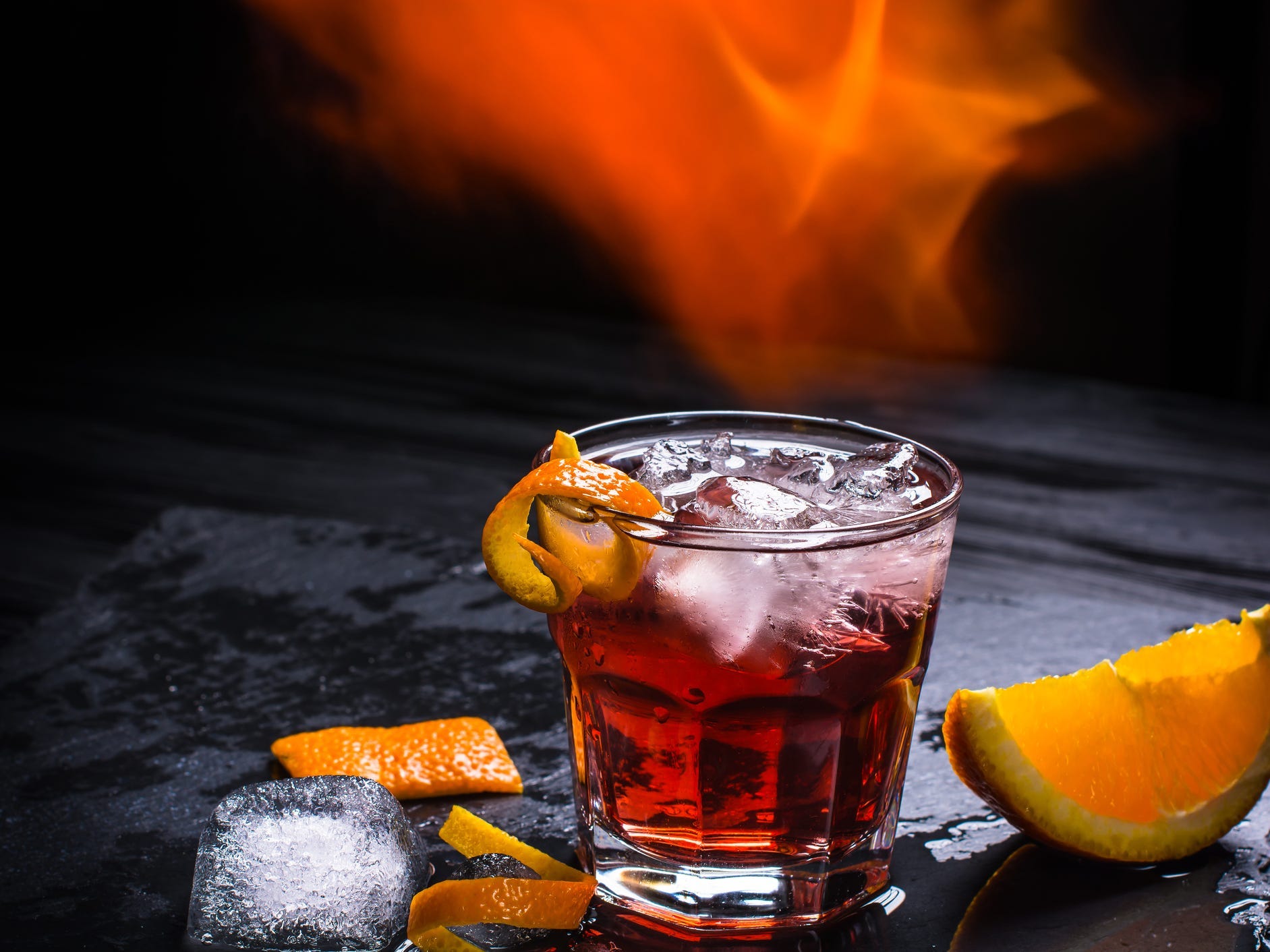 Mezcal Negroni with a black background