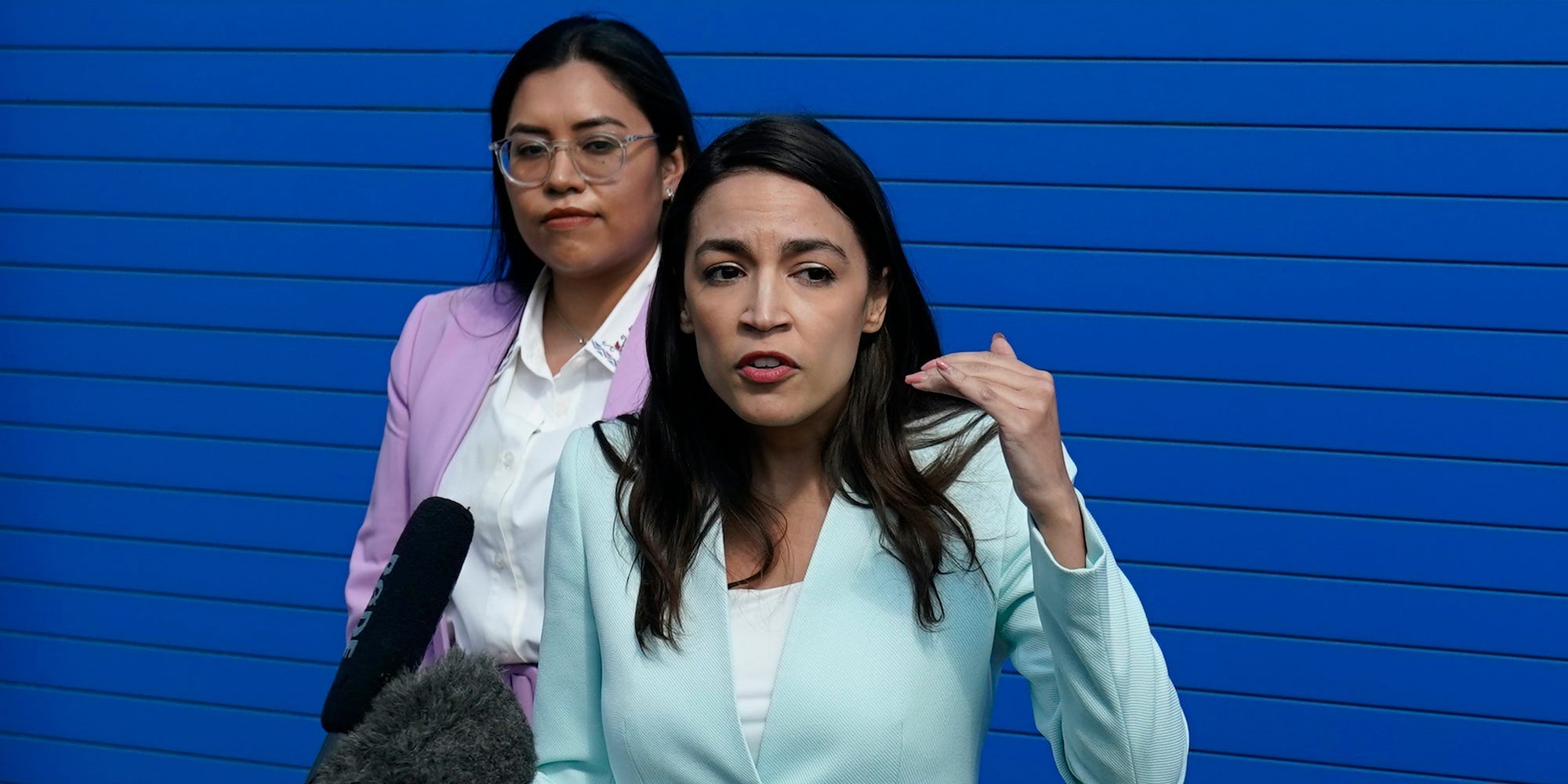 U.S. Rep. Alexandria Ocasio-Cortez, right, and Democratic Congressional candidate Jessica Cisneros speak to the media before a rally, Saturday, Feb. 12, 2022, in San Antonio.