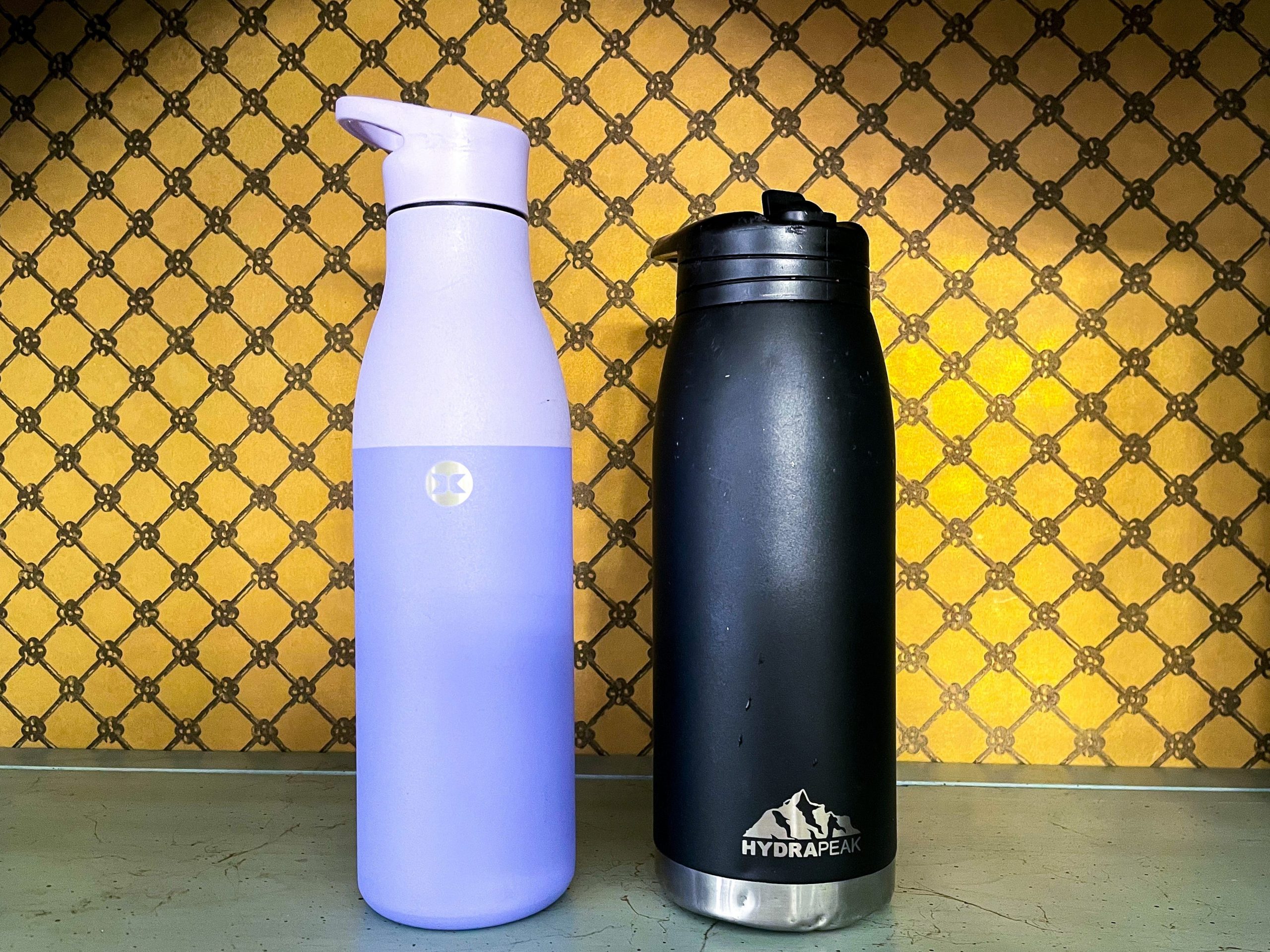 Water bottles against a yellow background