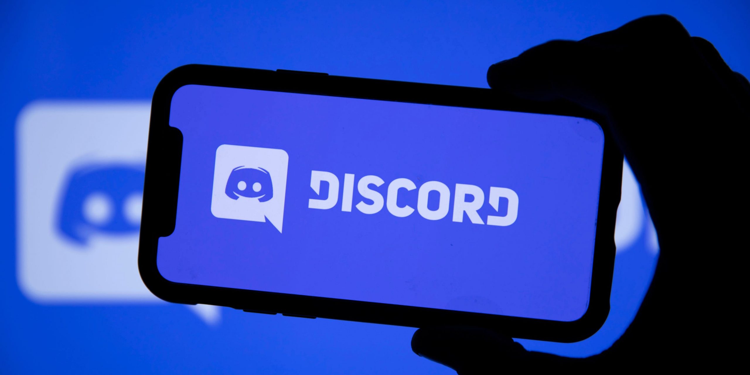 The Discord logo displayed on an iPhone.