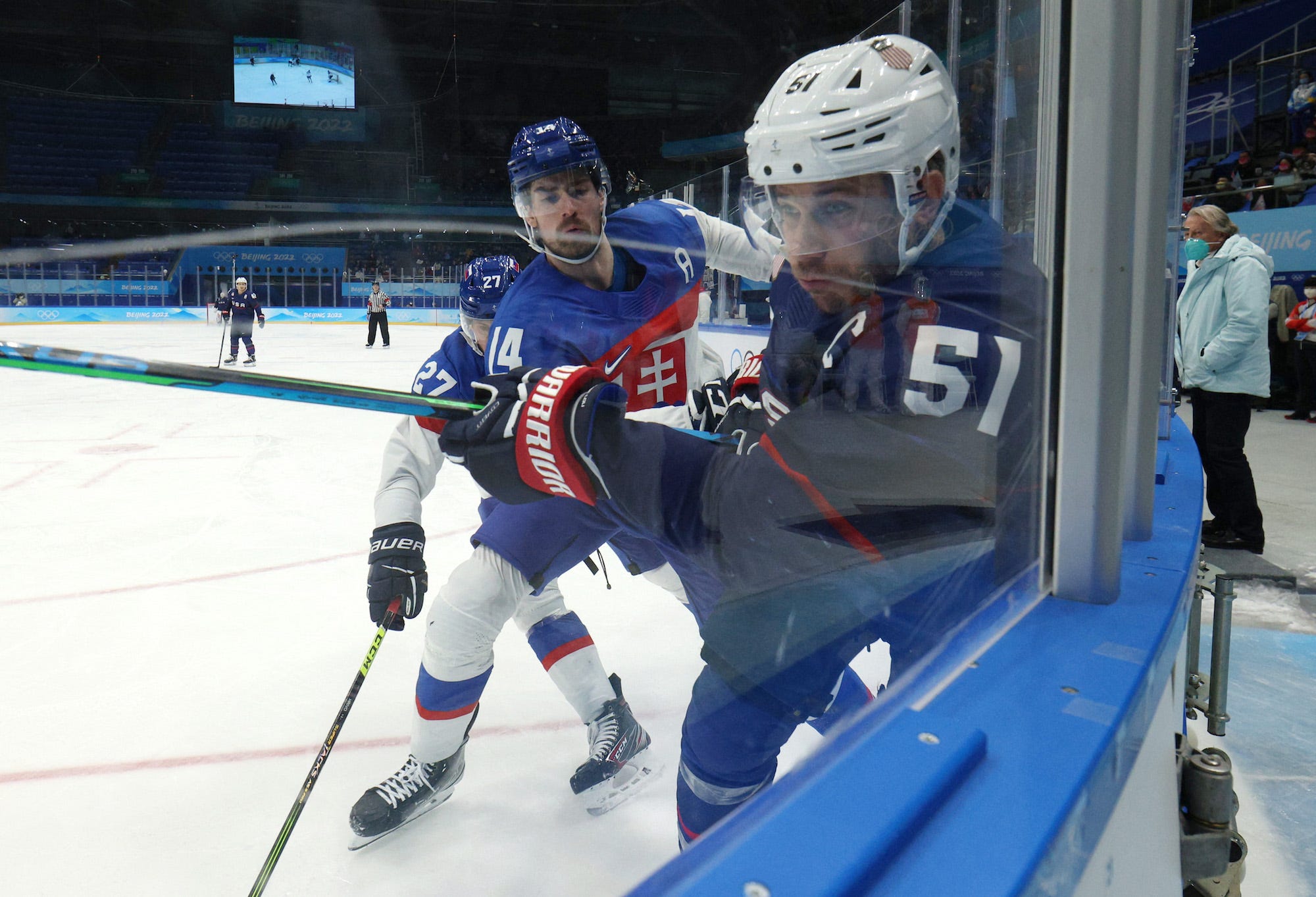 Andy Miele of the United States in action with Peter Ceresnak of Slovakia and Marek Hrivik of Slovakia