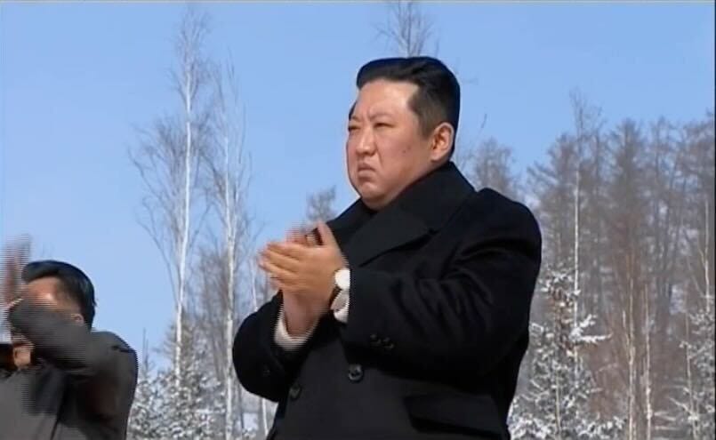 North Korean leader attending an outdoor meeting celebrating his father and former North Korean leader Kim Jong Il.