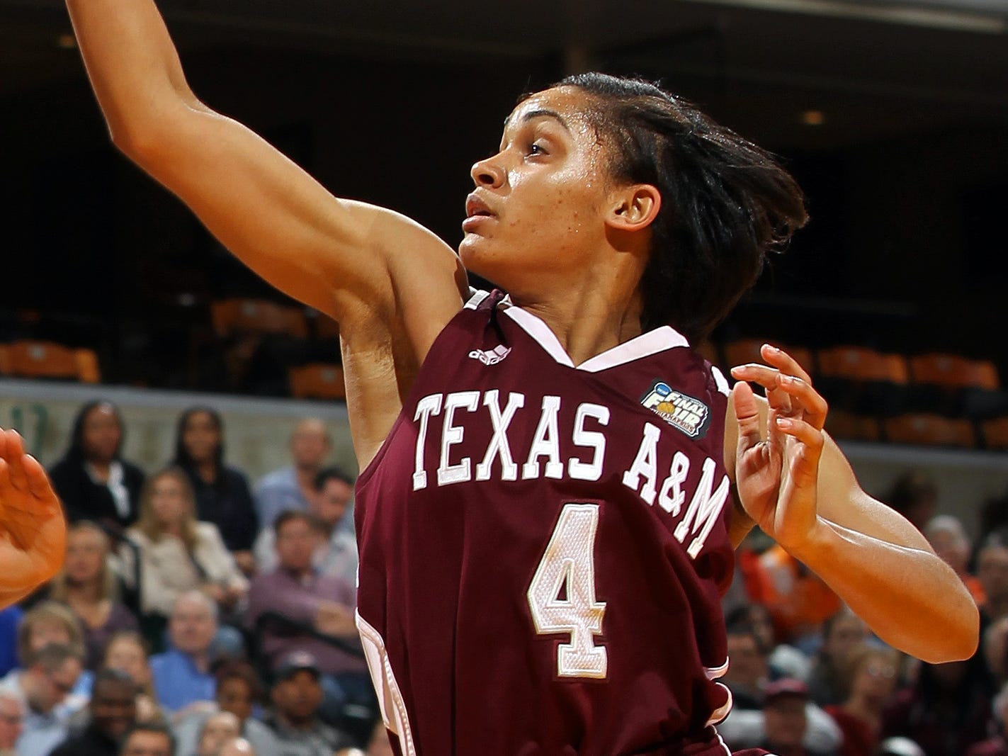 Basketball coach Sydney Carter defended her choice to wear pink leather