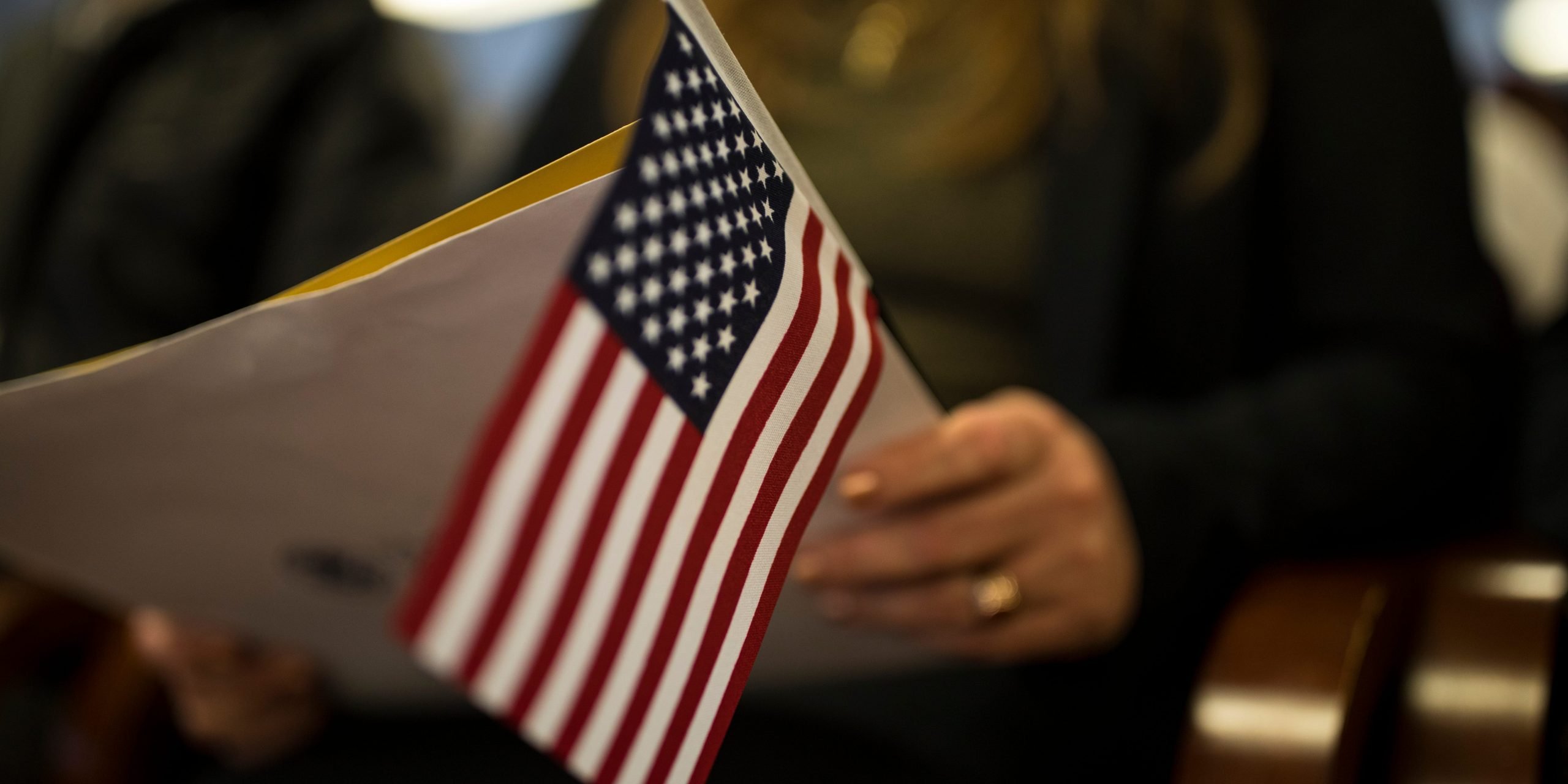 Woman holding US flag