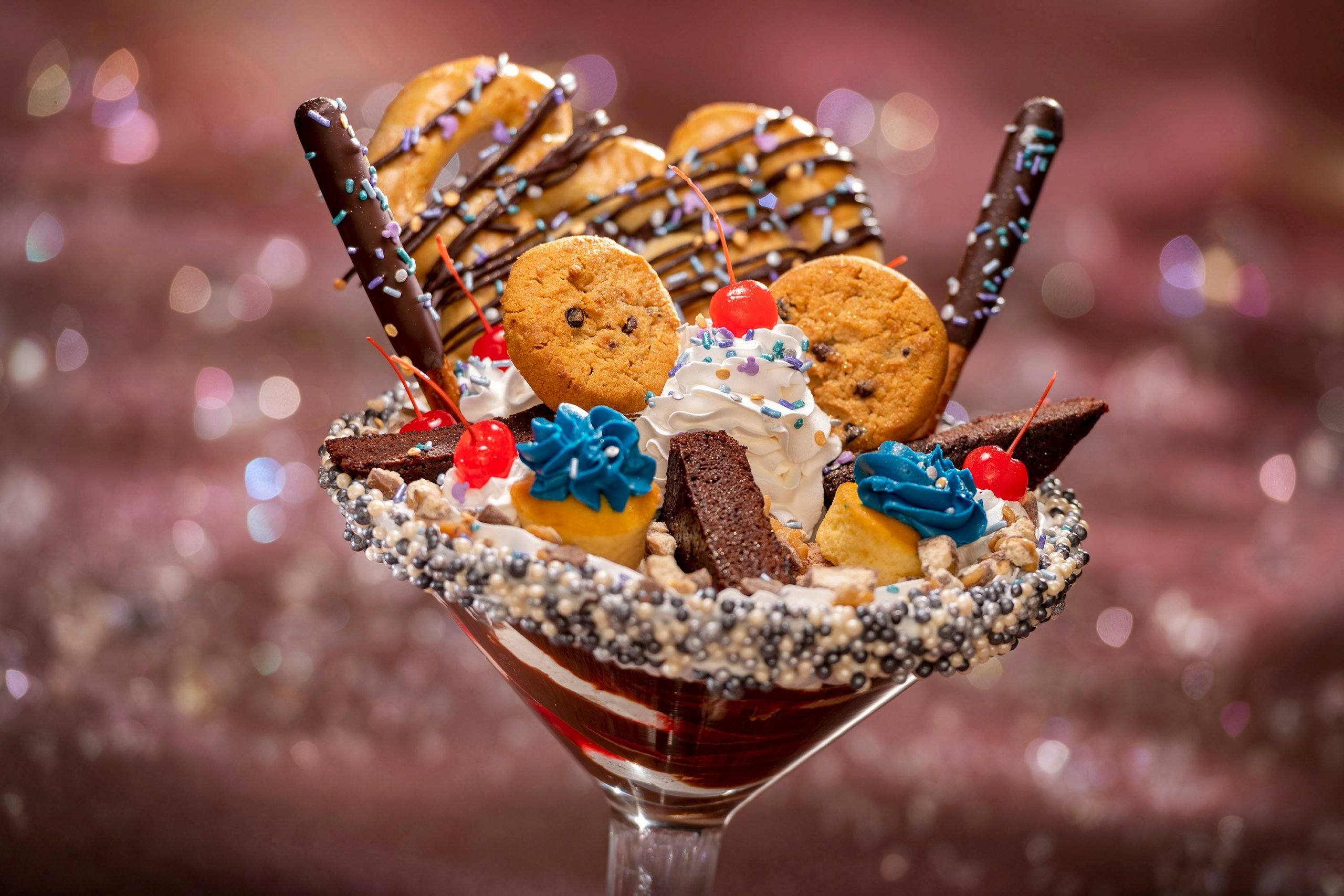 One of Disney's culinary creations, which is a chocolate-filled martini glass with a mound of miniature cookies on top.