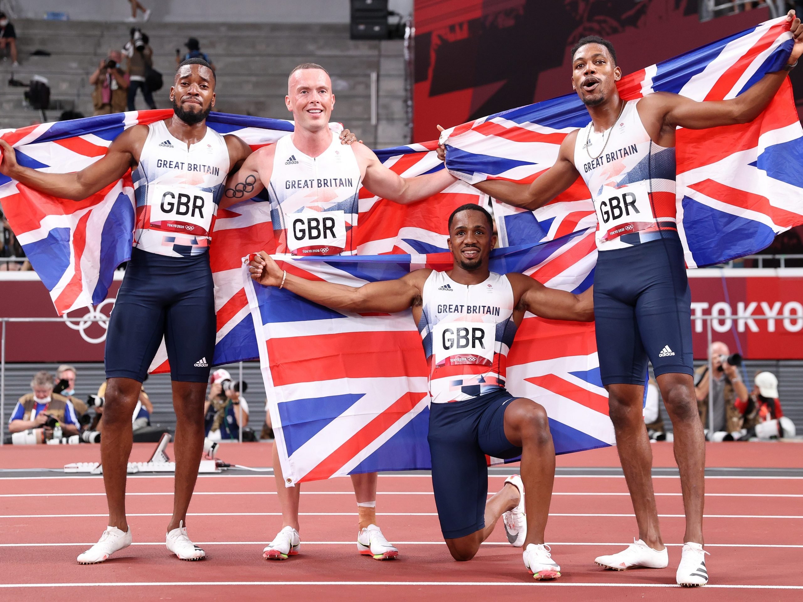 Nethaneel Mitchell-Blake, Richard Kilty, CJ Ujah and Zharnel Hughes of Team Great Britain celebrate winning the silver medal in the Men's 4 x 100m Relay Final on day fourteen of the Tokyo 2020 Olympic Games at Olympic Stadium on August 06, 2021 in Tokyo, Japan.