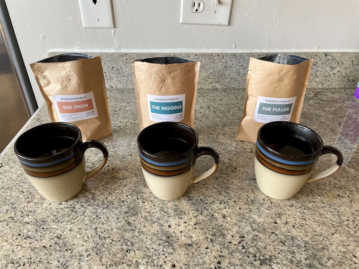 Image of three bags of generous coffee and three mugs for generous coffee review 2022