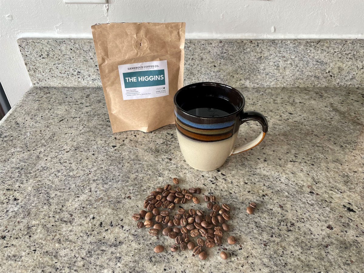 Image of a cup of coffee with a generous coffee bag and beans for generous coffee review 2022