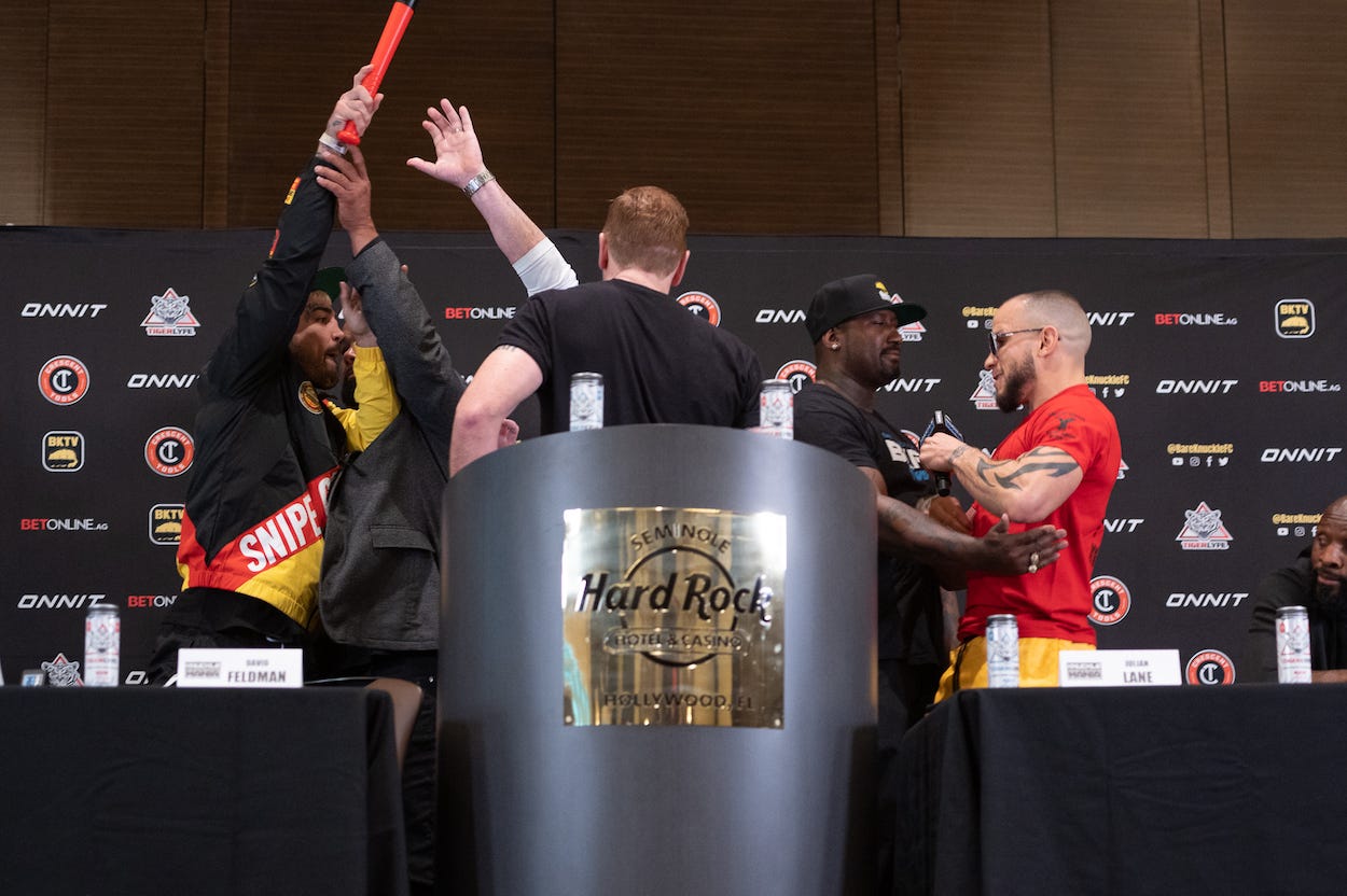 Mike Perry brought a bat to the press conference.
