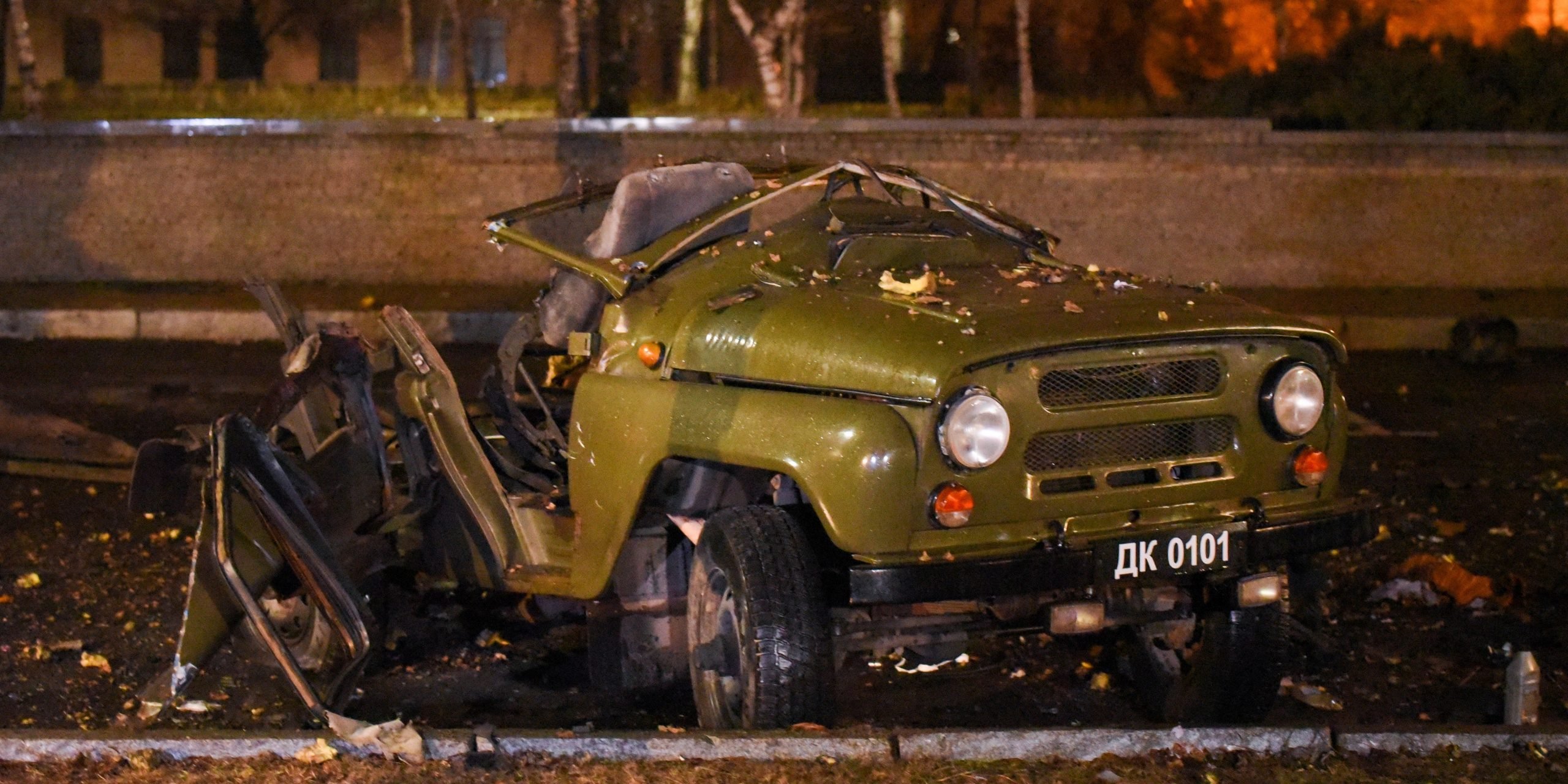 A car blown up on a parking lot outside a government building in central Donetsk, on February 18, 2022