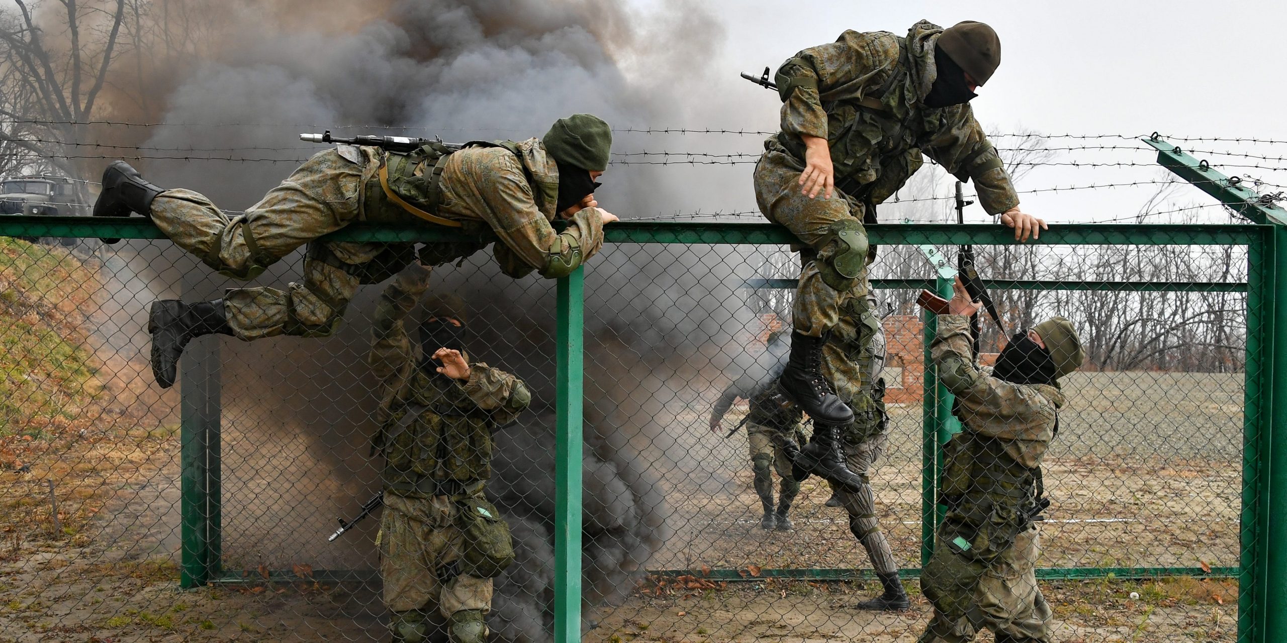 Servicemen take part in a military exercise to hold off an attack on a military convoy by maneuver intruders and retake a building held by a reconnaissance division of the Russian Pacific Fleet's naval infantry at Gornostay Range.