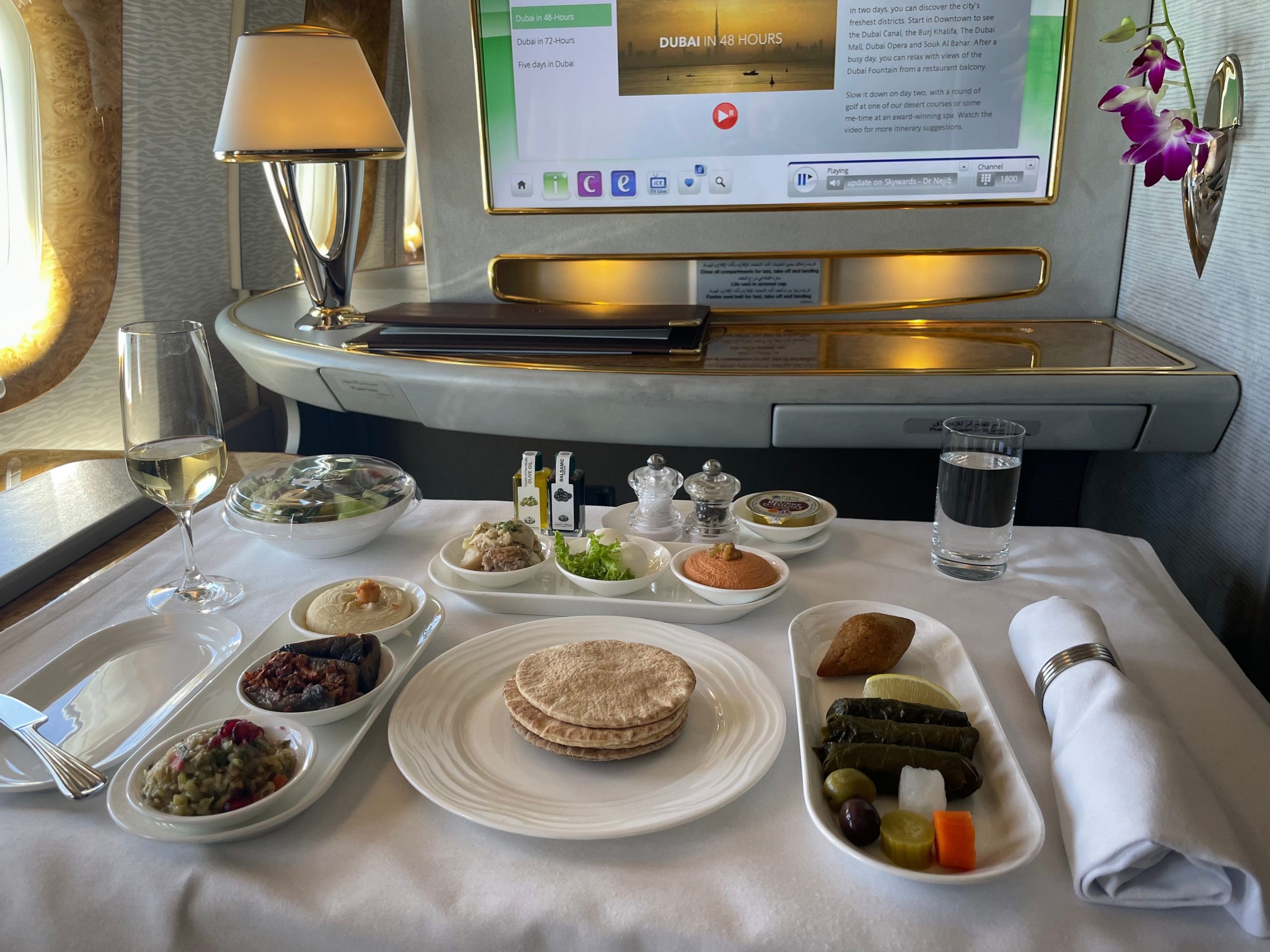 Arabic mezze, including bread, assorted vegetables, and dips, on table