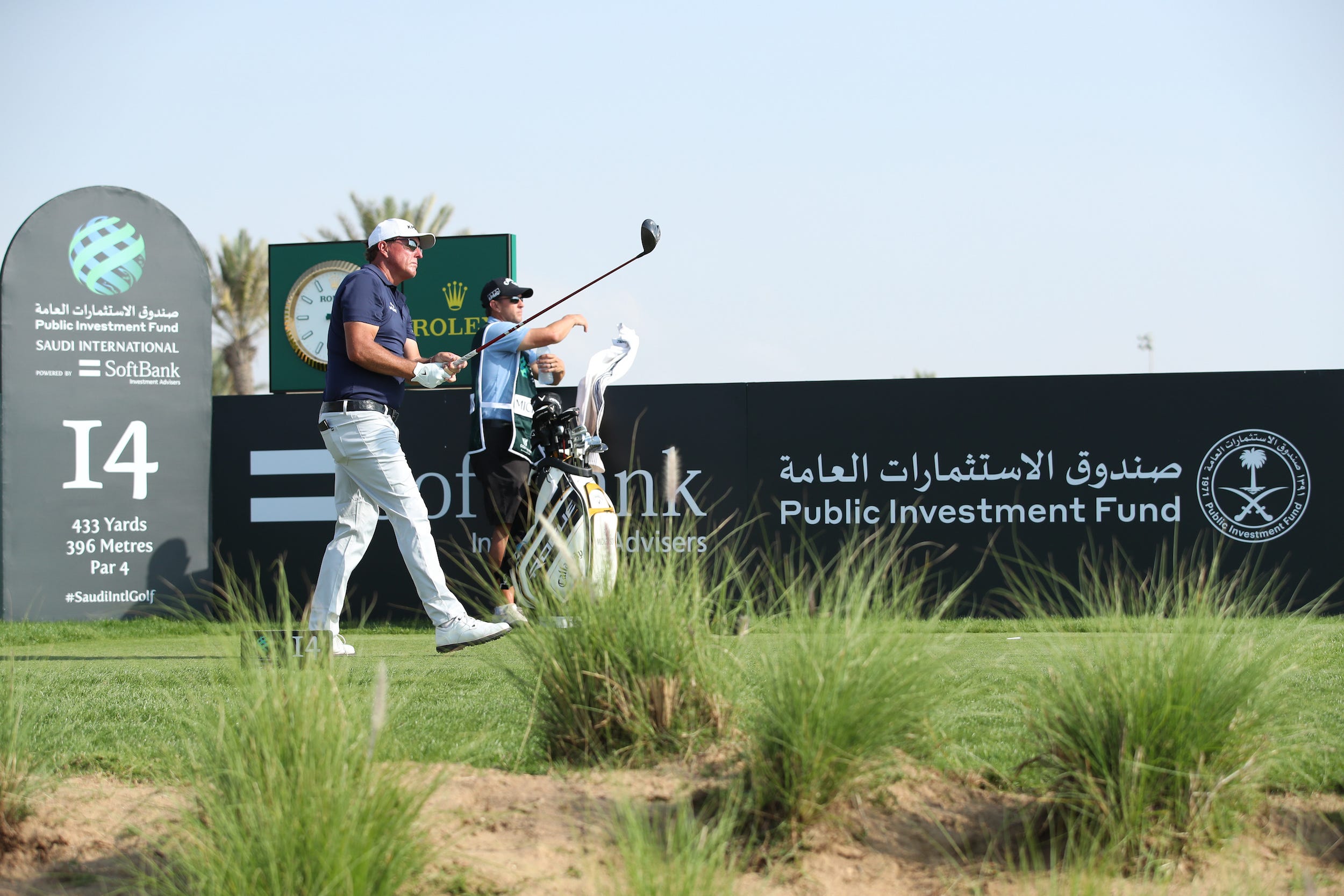Phil Mickelson tees off on the 14th hole at the PIF Saudi International at Royal Greens Golf & Country Club .