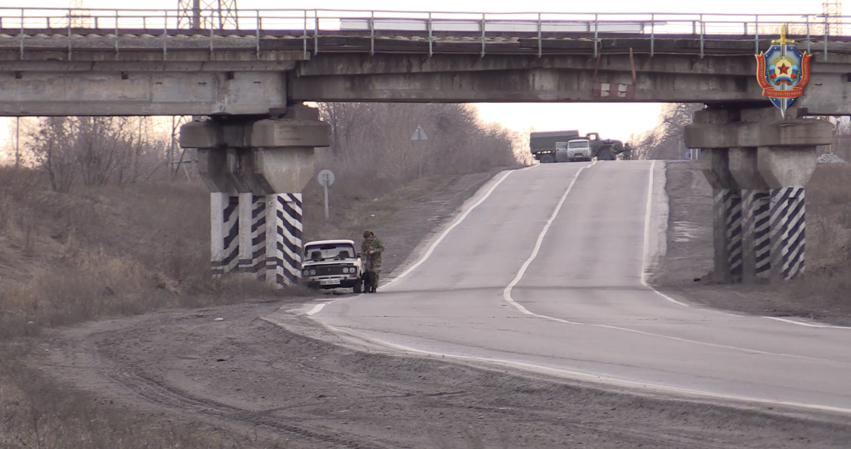 Video still shows car under railway bridge in Luhansk, Ukraine, said to be a car bomb.