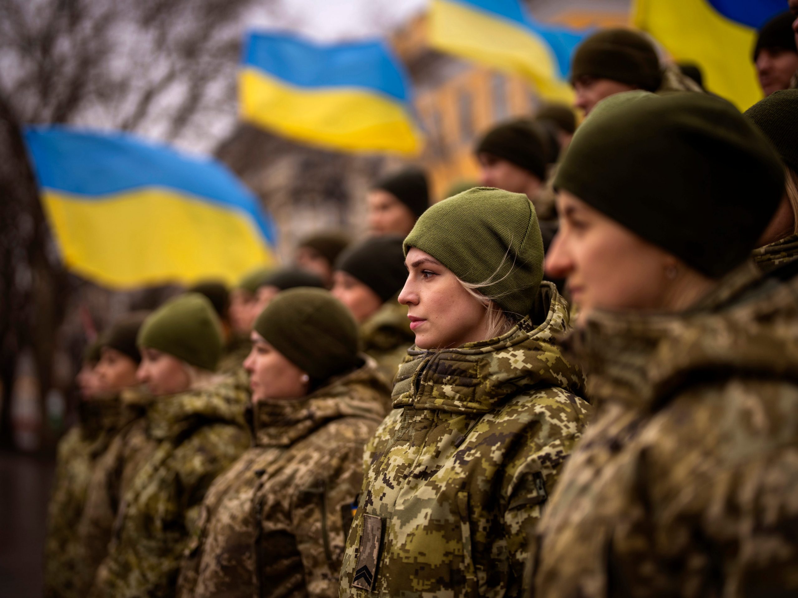 Ukrainian Army soldiers pose for a photo as they gather to celebrate a Day of Unity in Odessa, Ukraine, Wednesday, Feb. 16, 2022.