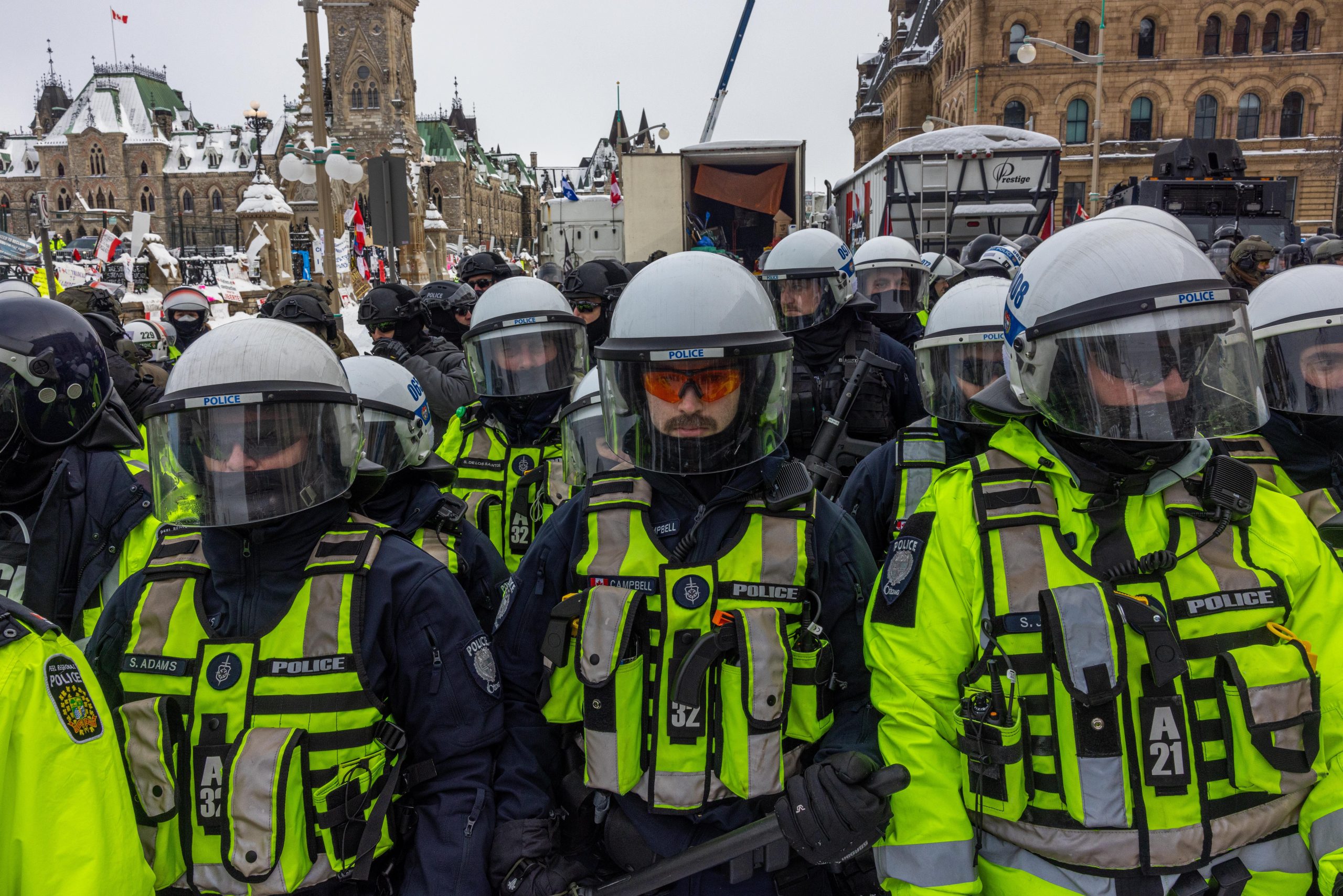 Police stand guard in vests and riot gear in Ottawa