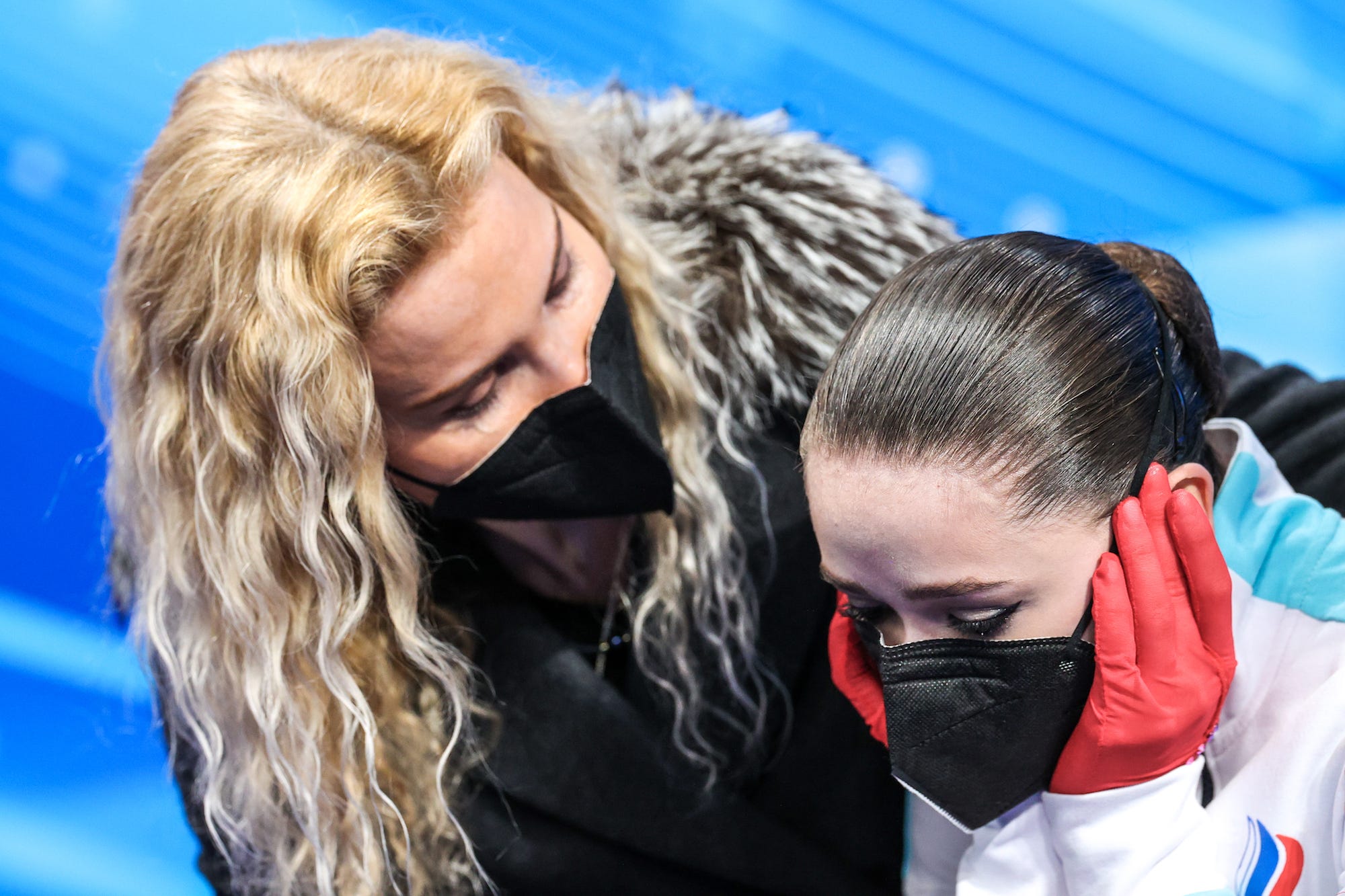Coach Eteri Tutberidze (L) and figure skater Kamila Valiyeva of Team ROC are seen after Valiyeva's performance in the women's free skating programme at the Capital Indoor Stadium at the 2022 Winter Olympic Games.