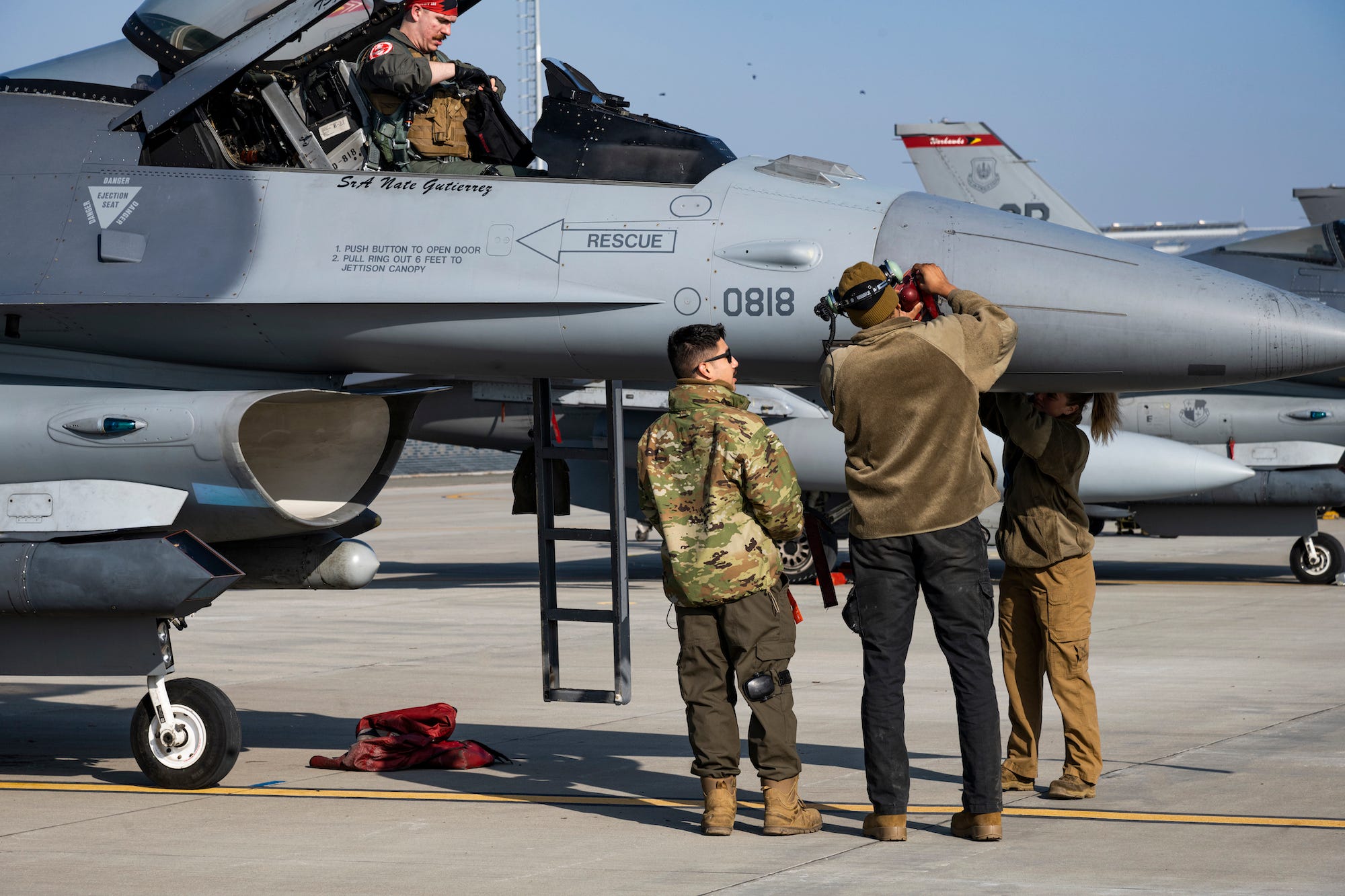 Air Force maintainers work on F-16 in Romania