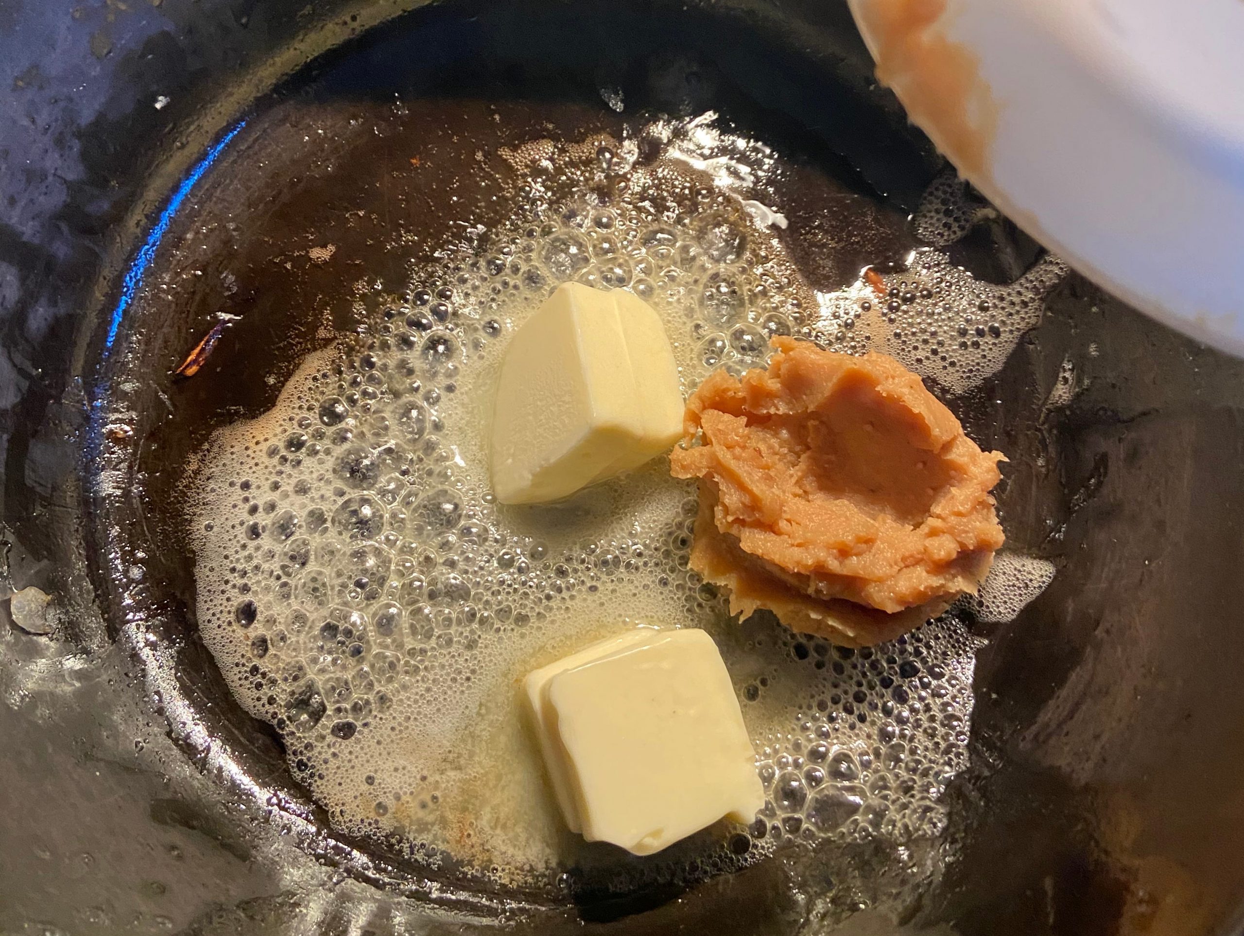 Butter and miso in deep pan together over stove