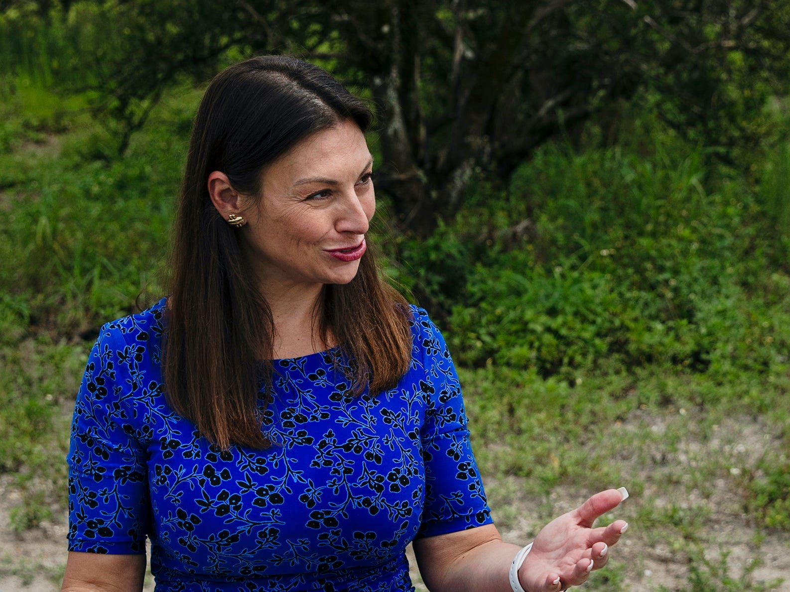ESTERO, FL - JUNE, 13: Florida agriculture commissioner Nikki Fried, center, speaks with Cody Lastinger, left, and Jeff Kreiger at Corkscrew Grove in Estero, FL on Thursday, June 13, 2019. Fried toured orange groves that are dying from citrus greening that could potentially be replaced with hemp plants. (Photo by Scott McIntyre/For The Washington Post via Getty Images)