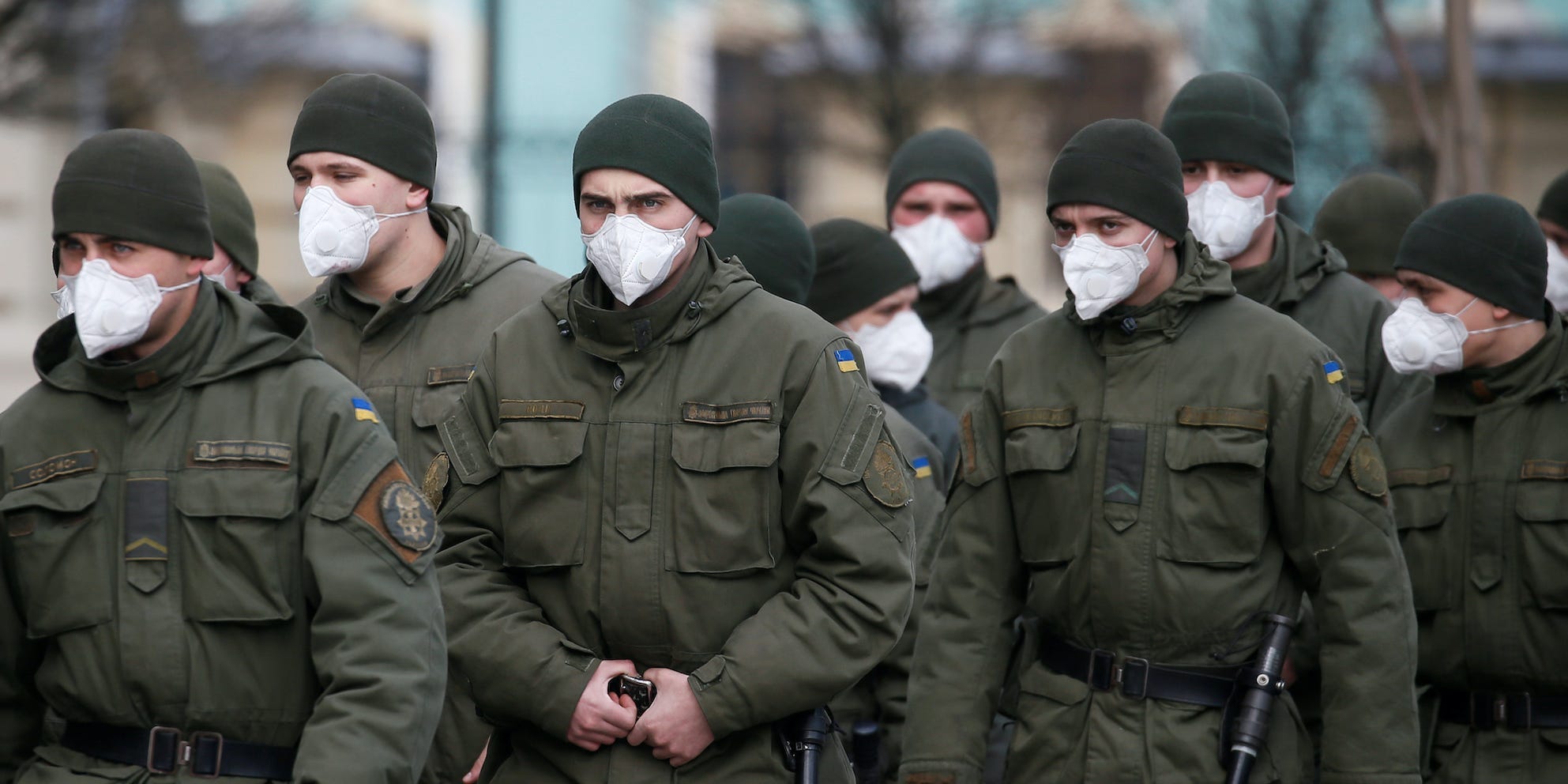 Members of Ukraine's national guard wearing uniforms and masks
