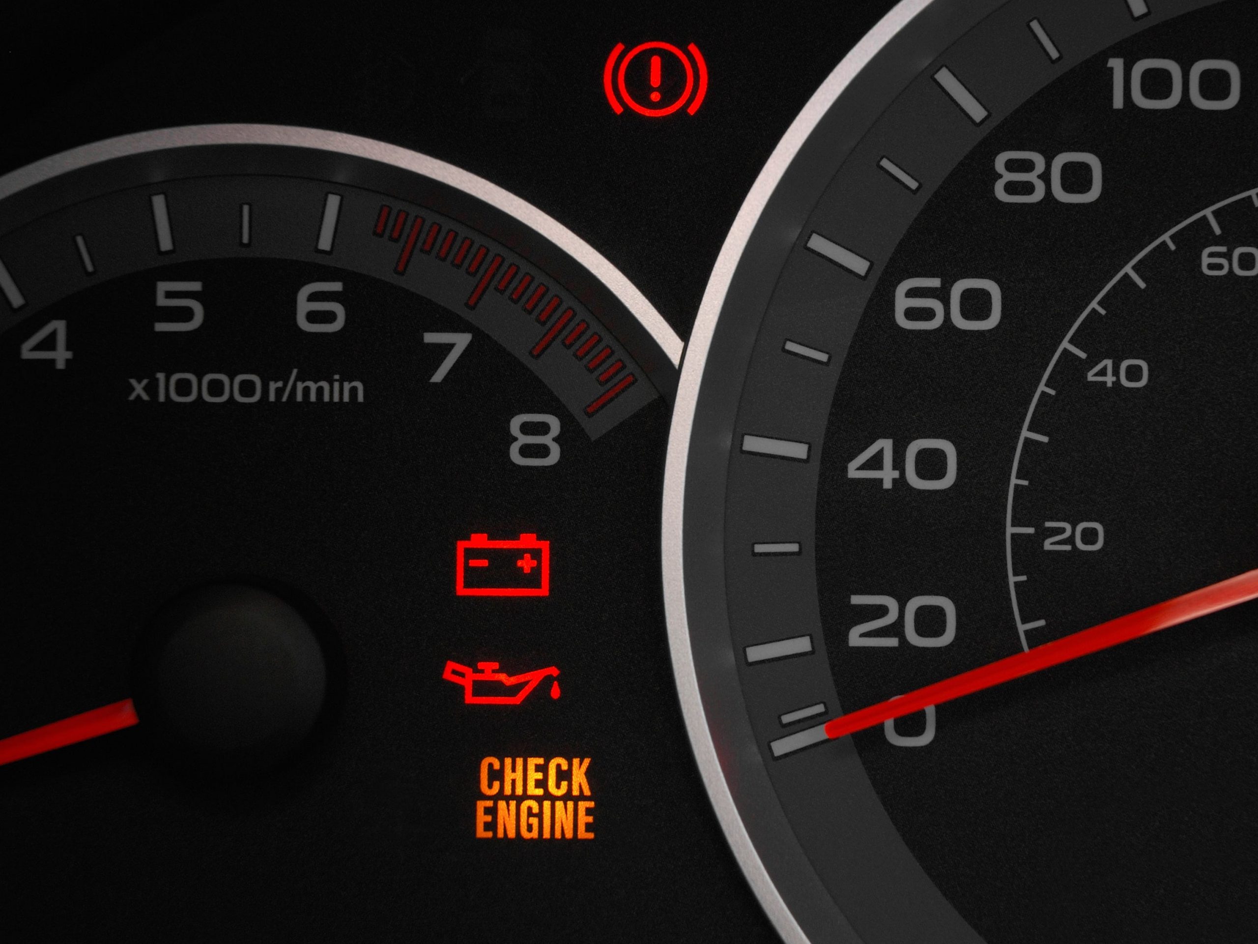 Battery and engine warning light on car dashboard