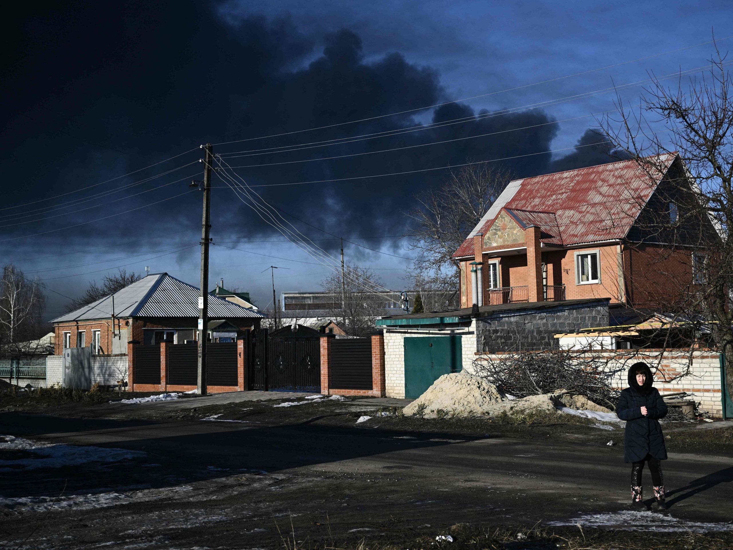 Black smoke rises from a military airport in Chuguyev near Kharkiv on February 24, 2022.