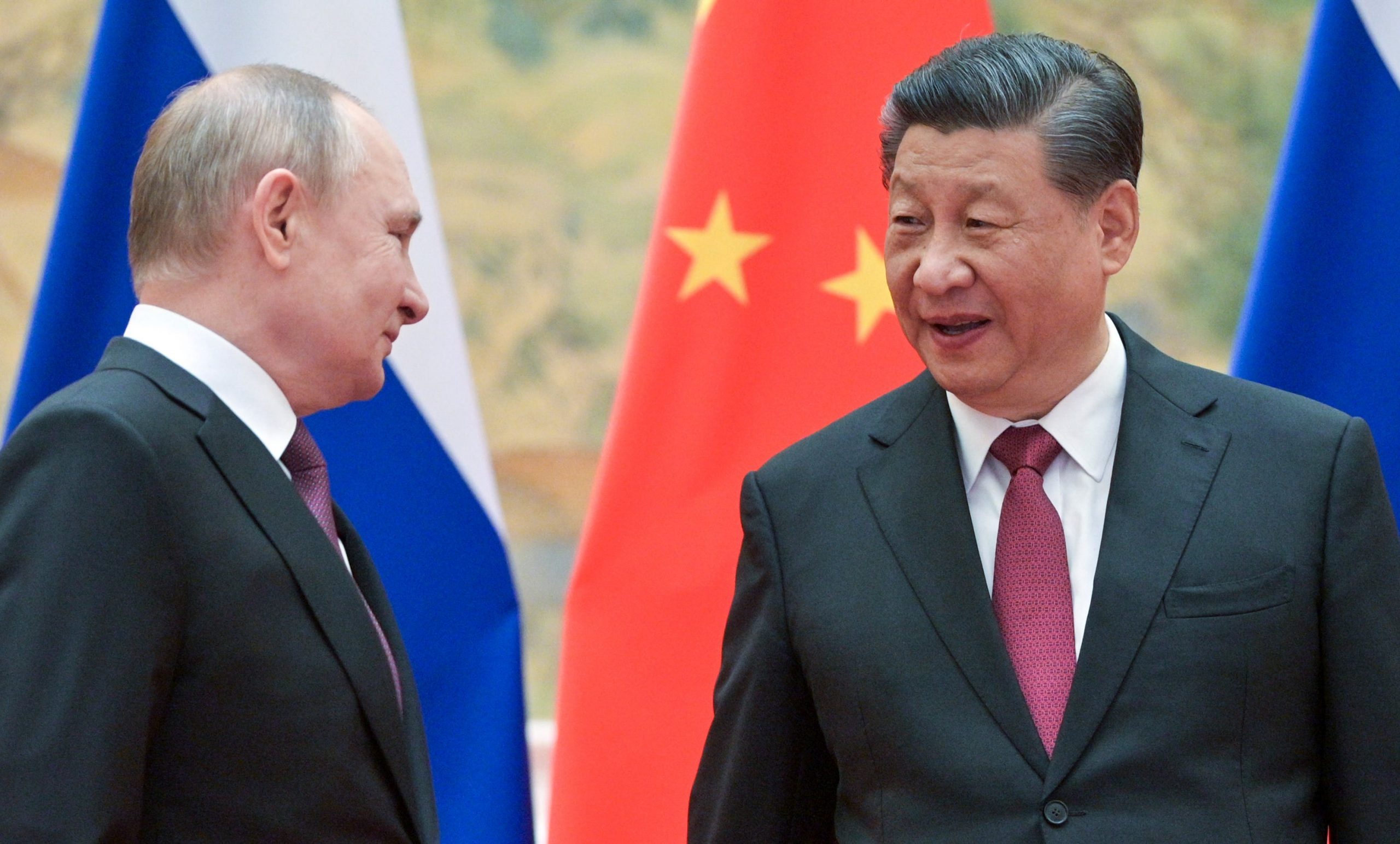 Russia's President Vladimir Putin (L) and his Chinese counterpart Xi Jinping pose during a meeting at the Diaoyutai State Guesthouse.