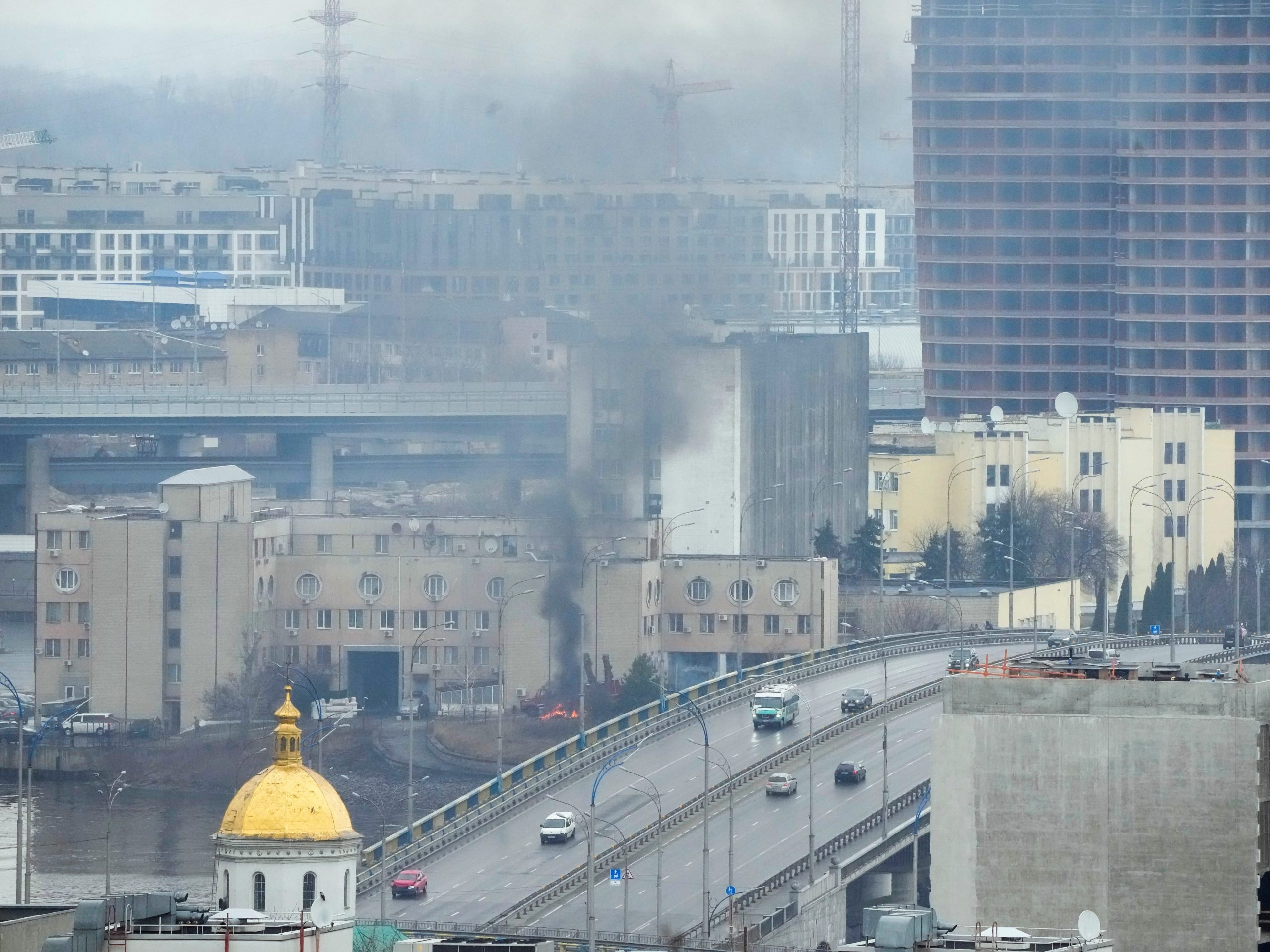 Smoke and flame rise near a military building after an apparent Russian strike in Kyiv, Ukraine, Thursday, Feb. 24, 2022.