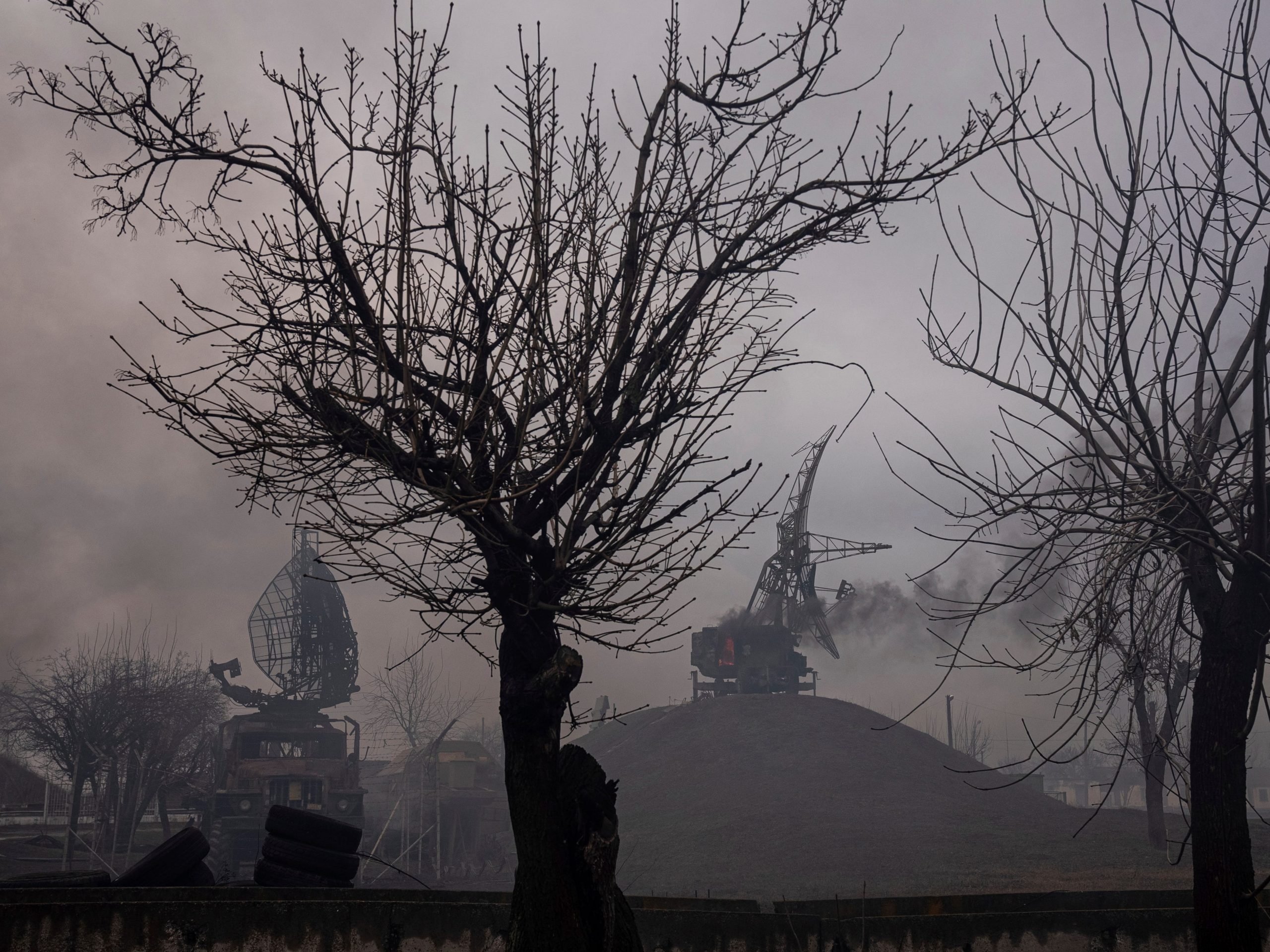 Smoke rises from an air defence base in the aftermath of an apparent Russian strike in Mariupol, Ukraine, Thursday, Feb. 24, 2022.