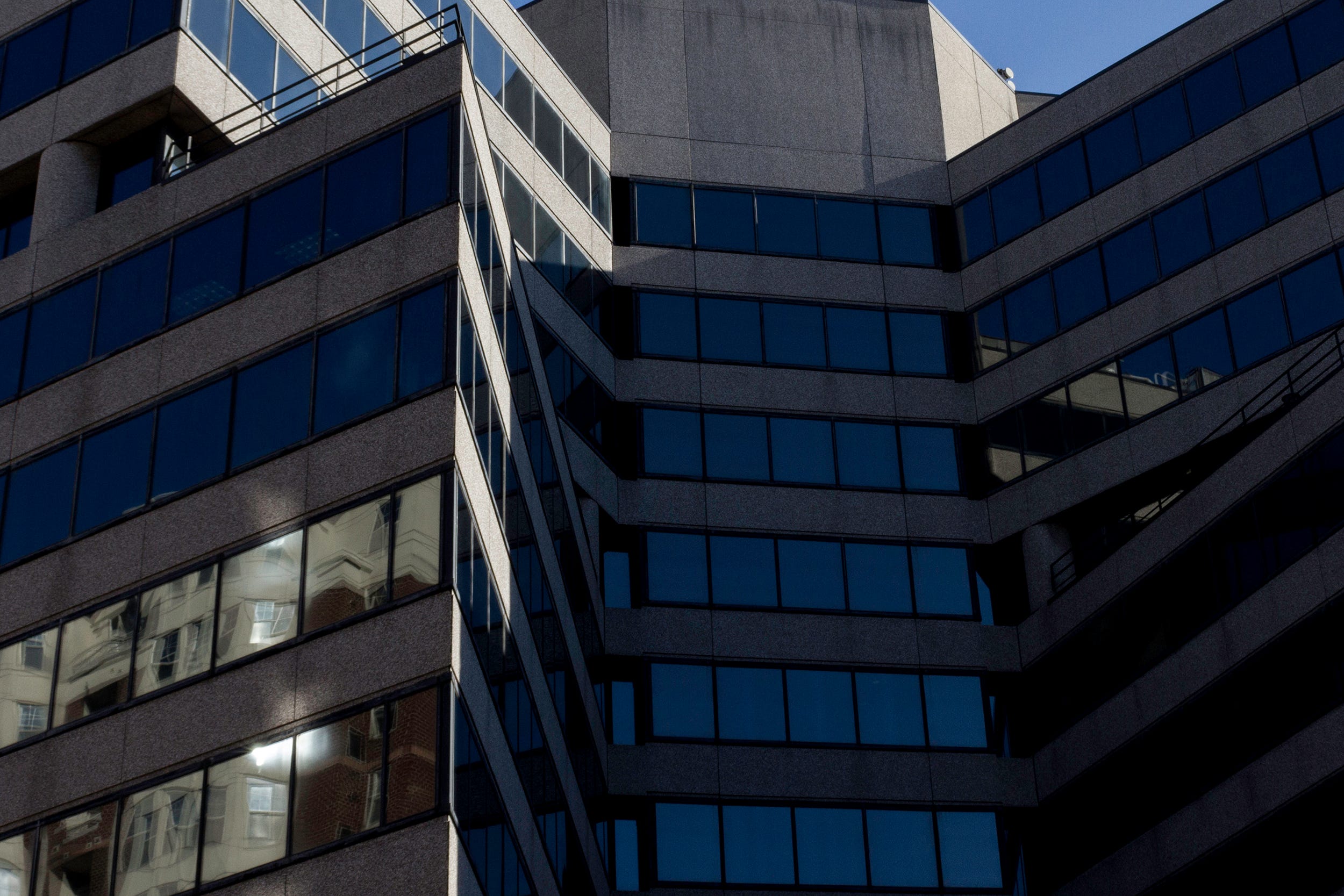 Looking up at the glass and concrete office building which houses RAINN headquarters.