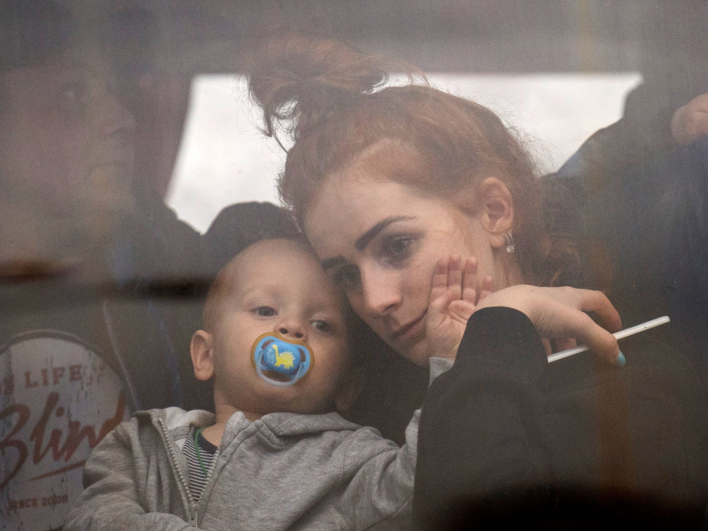 Woman and her baby fleeing Kyiv