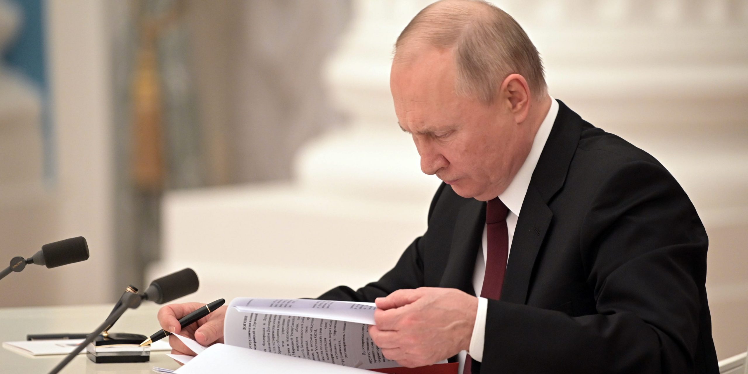 Russia's President Vladimir Putin signs decrees to recognize independence of the Donetsk and Lugansk People's Republics.