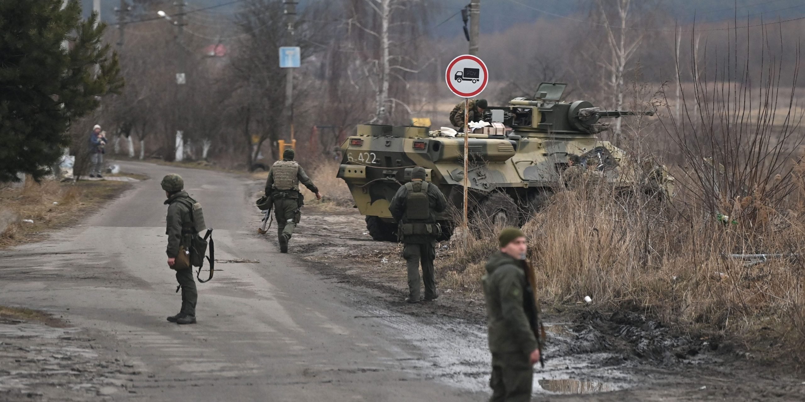 Ukrainian troops stand guard near Gostomel airport