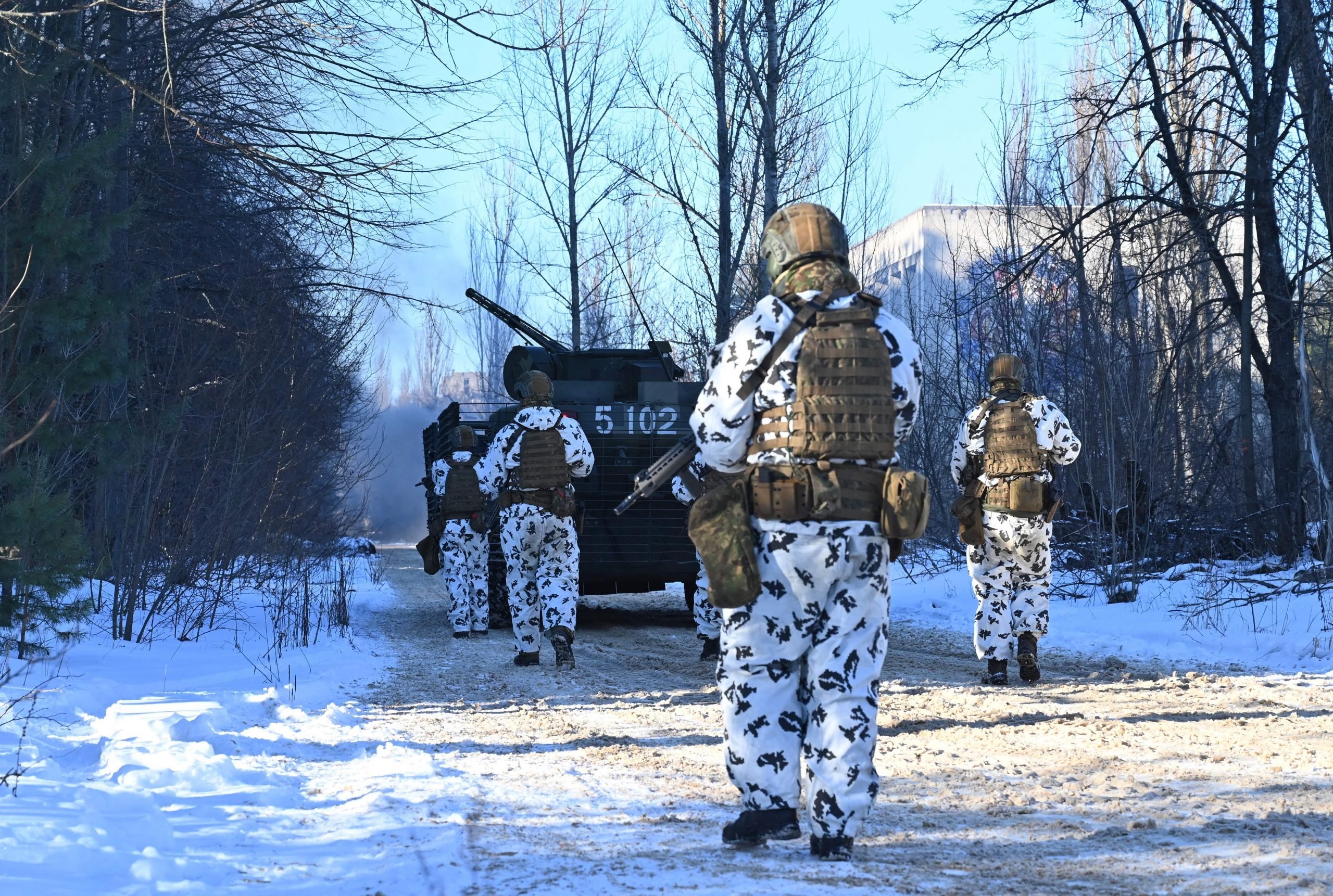 Servicemen take part in a joint tactical and special exercises of the Ukrainian Ministry of Internal Affairs, the Ukrainian National Guard and Ministry Emergency in a ghost city of Pripyat, near Chernobyl Nuclear Power Plant on February 4, 2022.