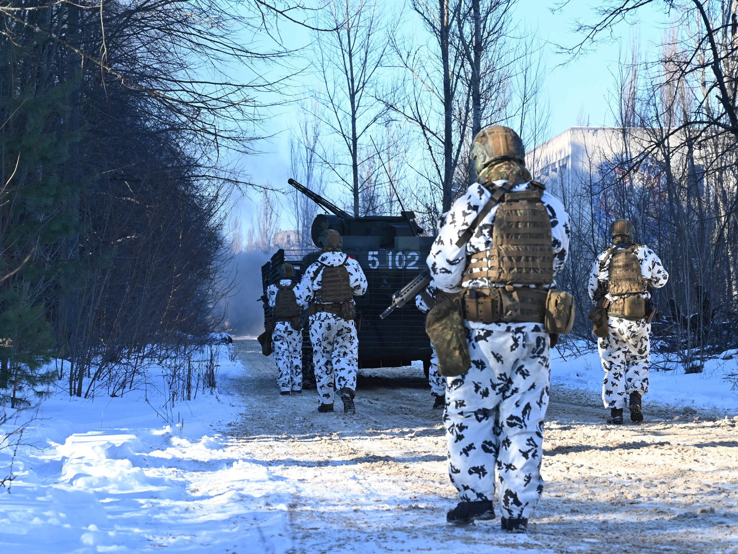 Servicemen take part in a joint tactical and special exercises of the Ukrainian Ministry of Internal Affairs, the Ukrainian National Guard and Ministry Emergency in a ghost city of Pripyat, near Chernobyl Nuclear Power Plant on February 4, 2022.